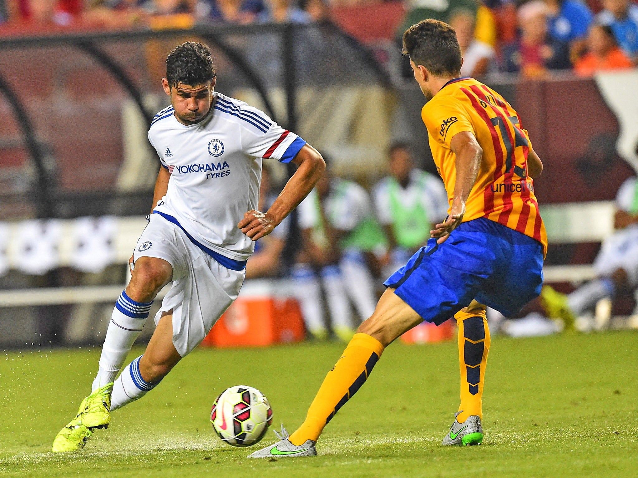 Diego Costa takes on Barcelona defender Marc Bartra during Chelsea’s 2-2 draw in Washington on Tuesday. Chelsea won 4-2 on penalties