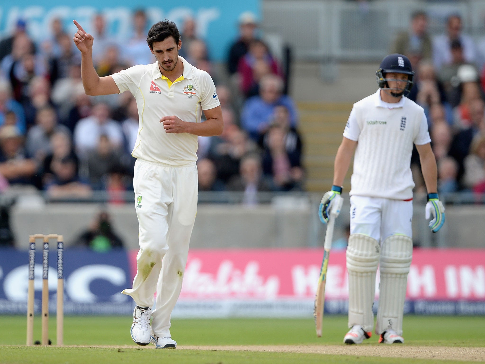 Mitchell Starc celebrates taking the wicket of Joe Root