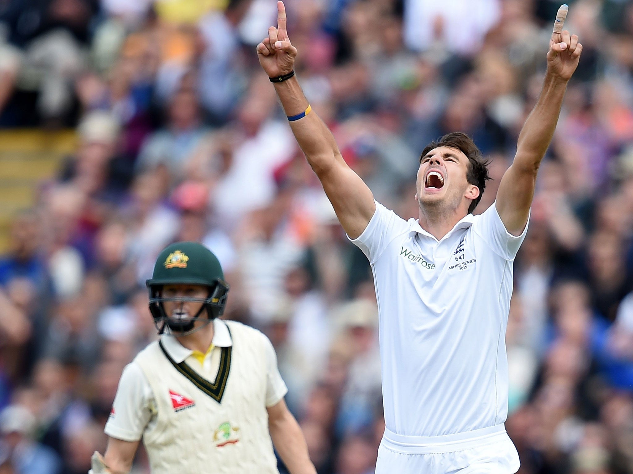 Steve Finn celebrates the wicket of Steve Smith