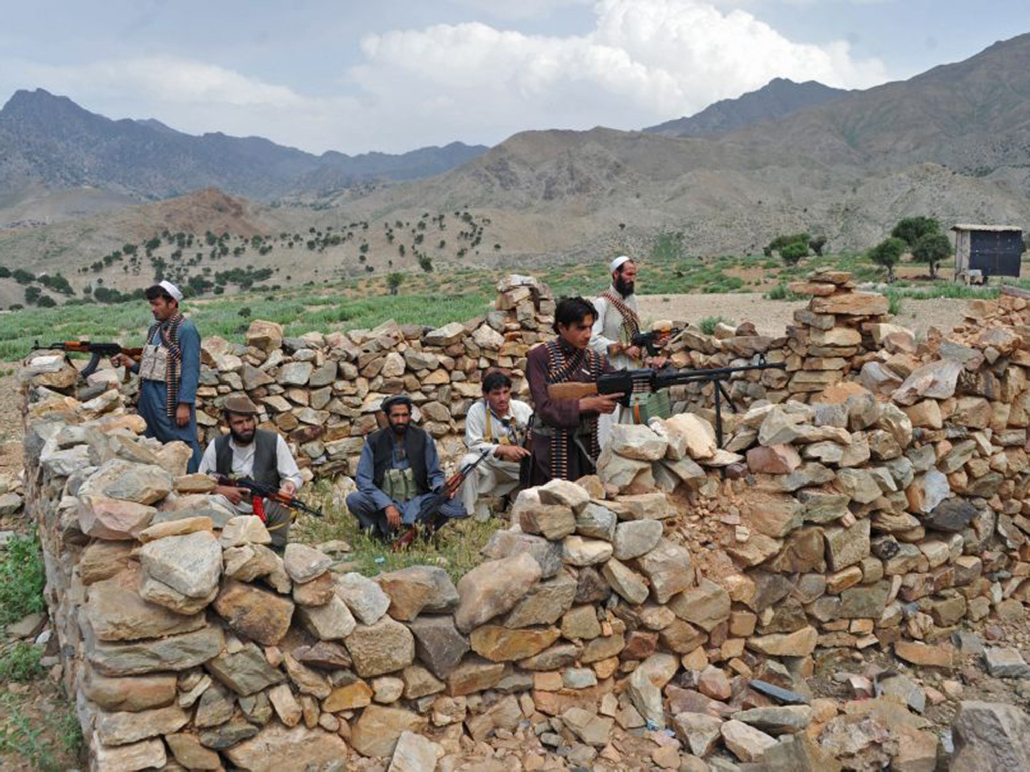 Civilians defend the village of Sor Kandaw, in the Afghan province of Nangarhar, against the Taliban in 2012