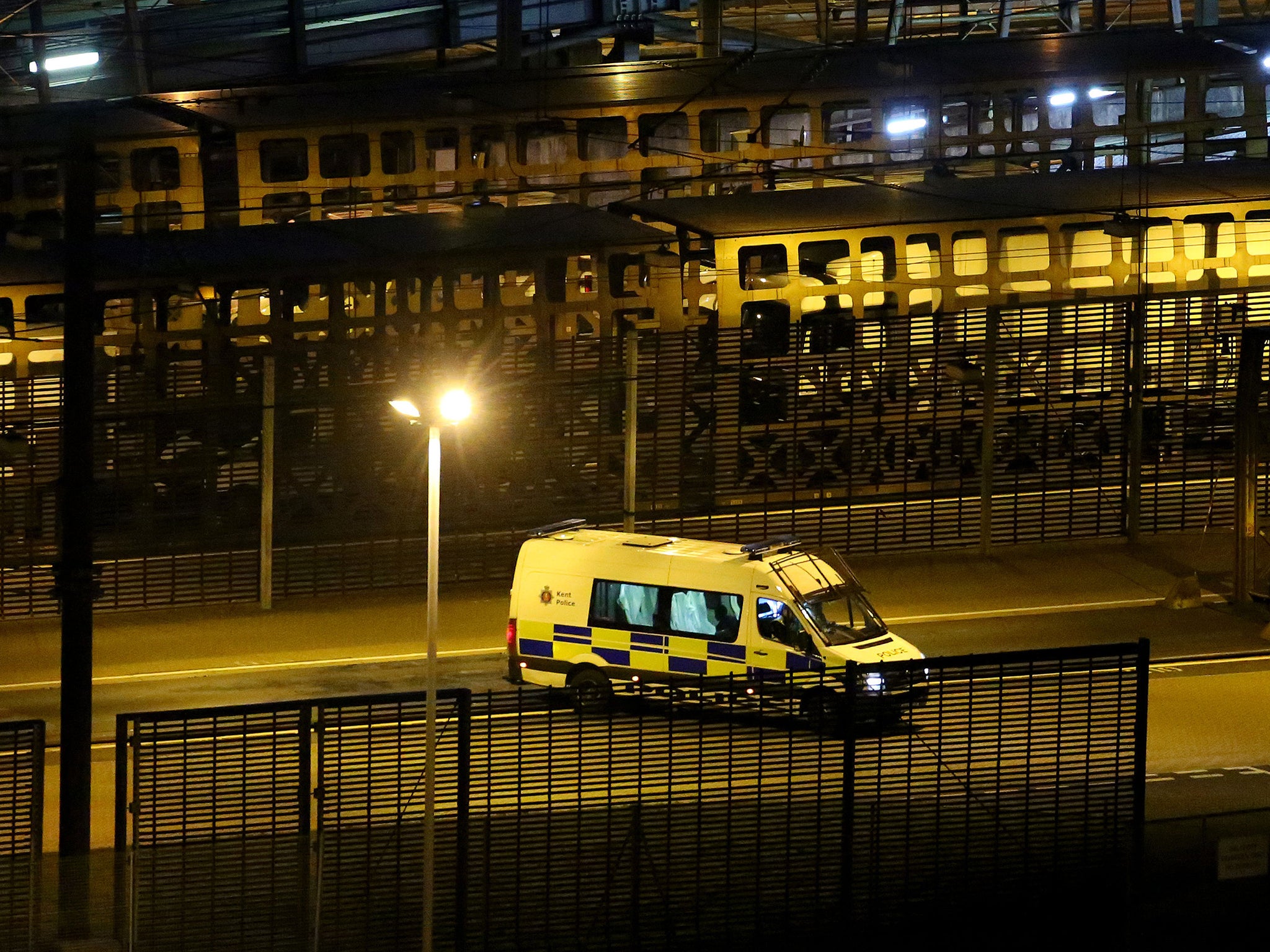 A police van patrols the Eurotunnel site in Folkestone