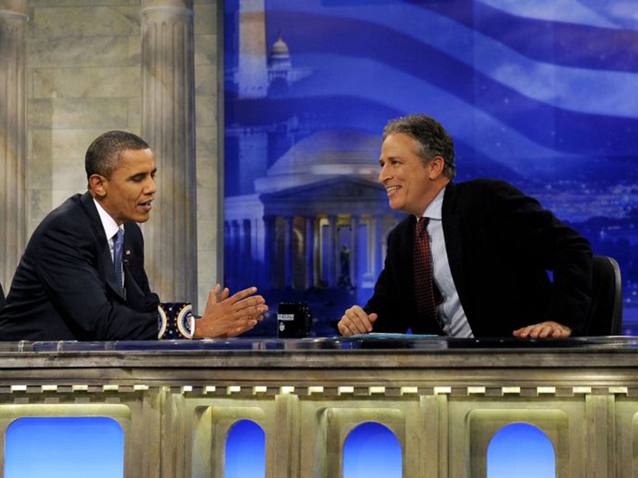 President Barack Obama (L) chats with Daily Show host Jon Stewart during a commercial break in taping in Washington, DC, USA, on 27 October 2010