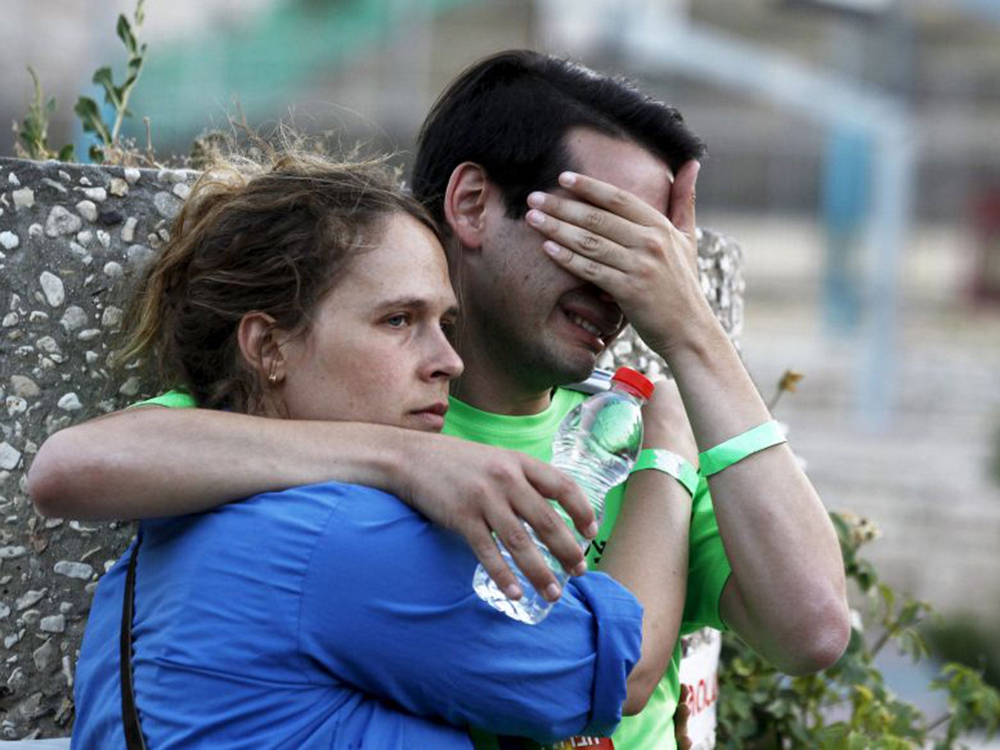 Participants of an annual gay pride parade react after an Orthodox Jewish assailant stabbed and injured six participants in Jerusalem on Thursday (Reuters)