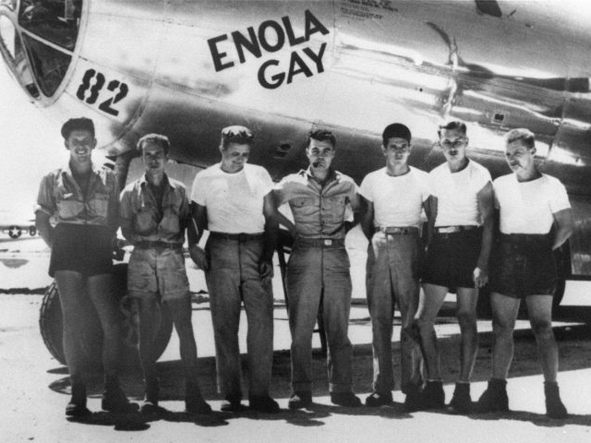 American bomber pilot Paul W. Tibbets Jr. (center) stands with the ground crew of the bomber 'Enola Gay'