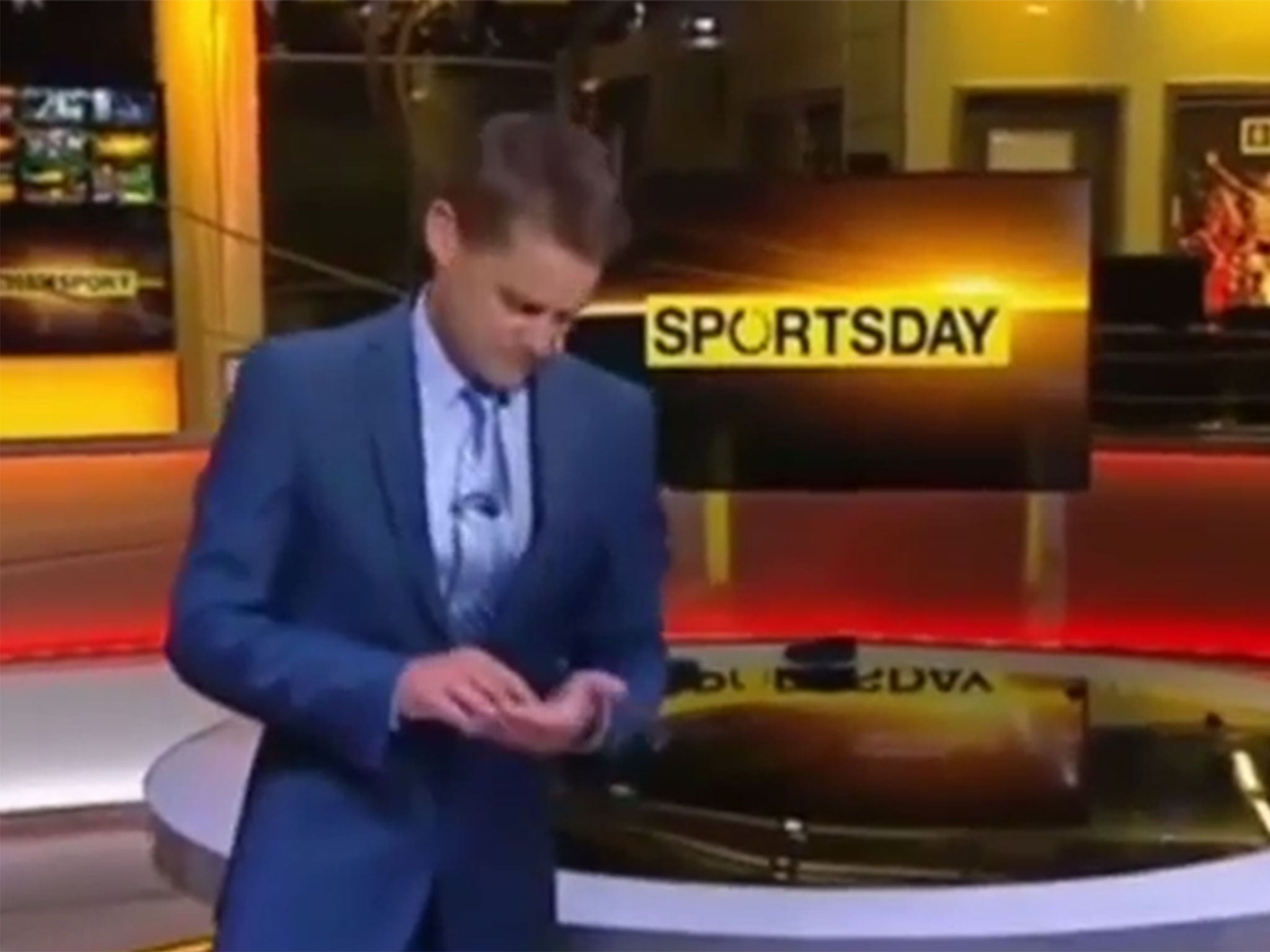 Chris Mitchell taps an imaginary iPad