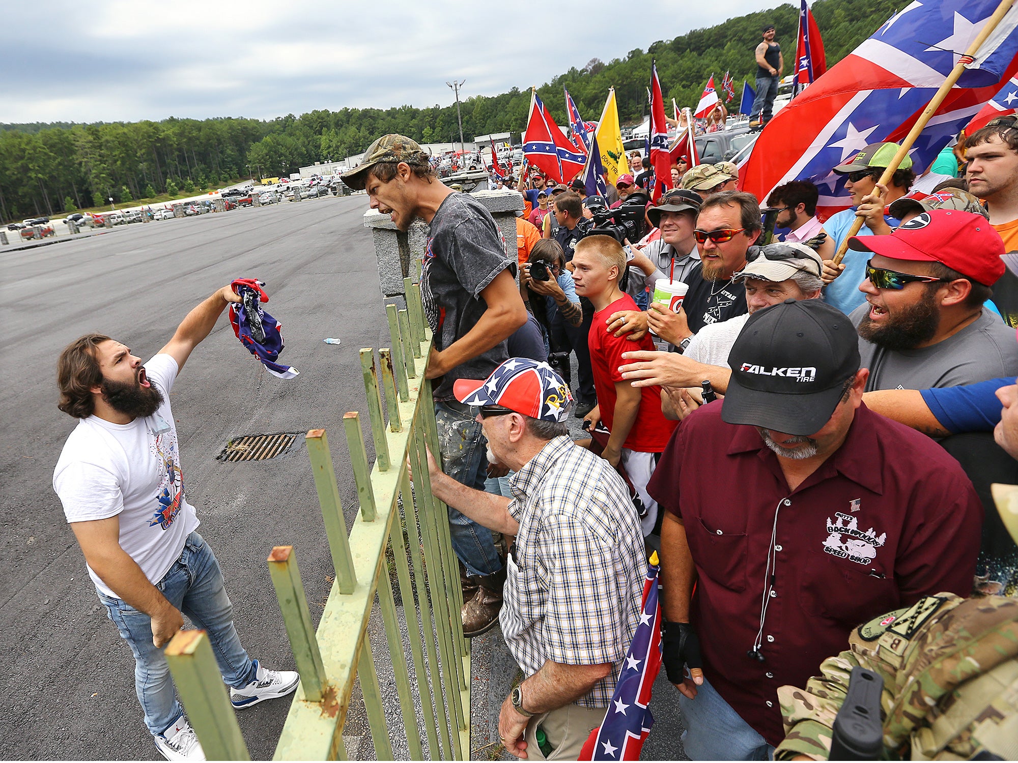 Man confronts Confederate flag rally