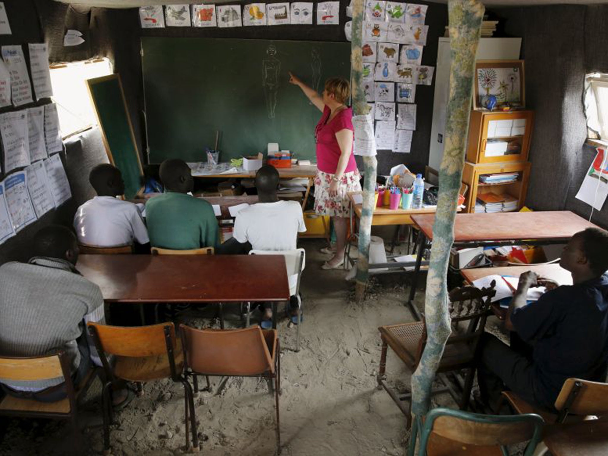 Véronique, a French volunteer teacher, gives a course to help migrants near Calais