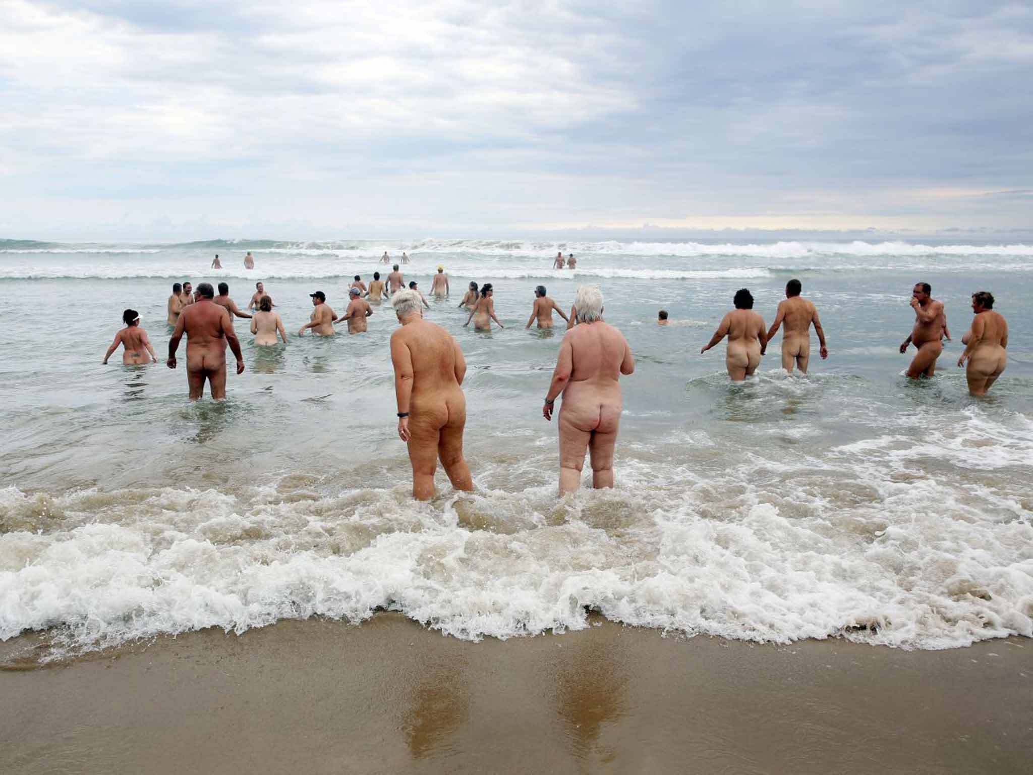 If you're alone, you're just naked, but if you are in a group standing around in the buff, then you are a nudist