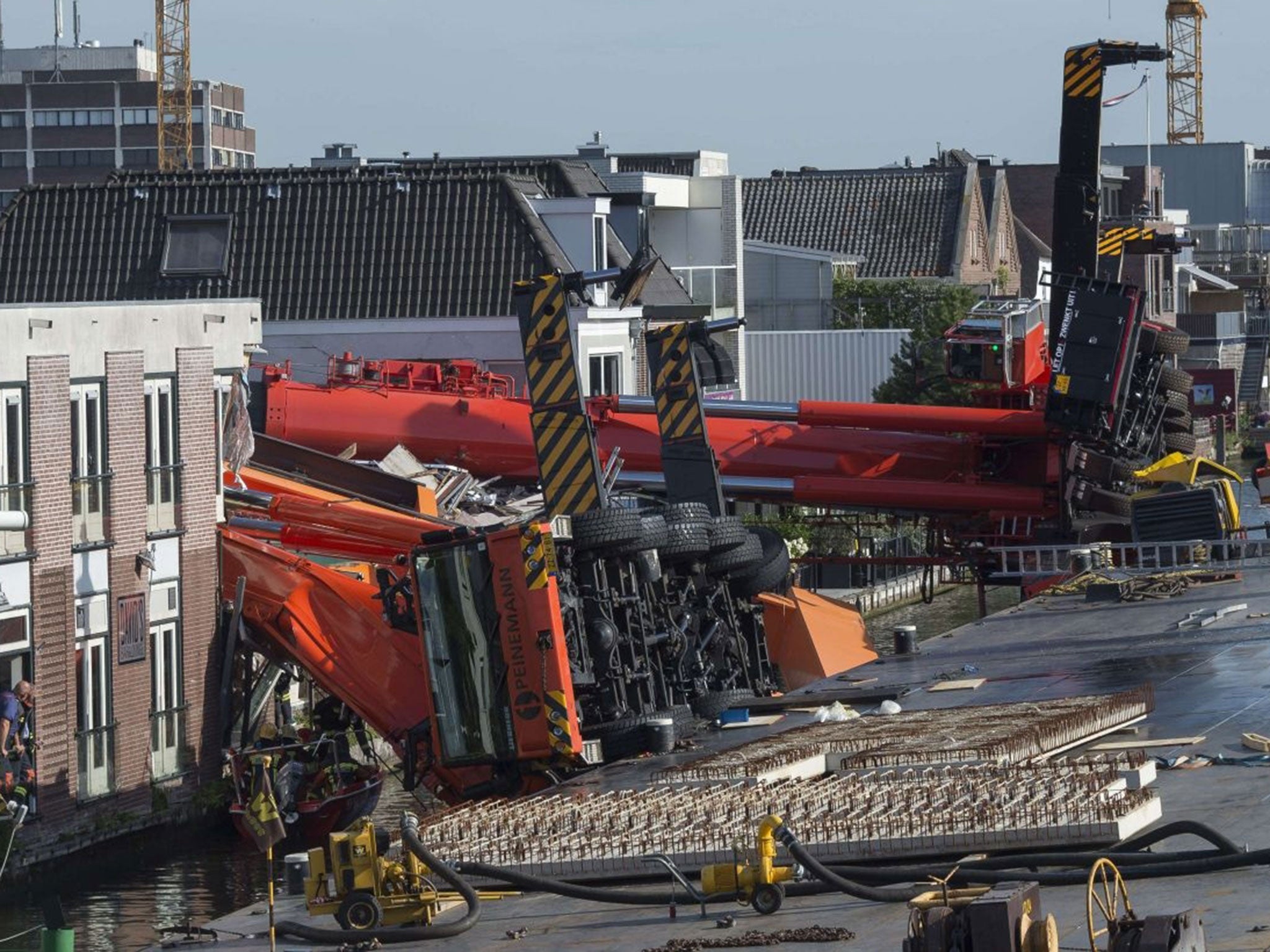 The two cranes that have fallen onto houses in Alphen aan den Rijn.