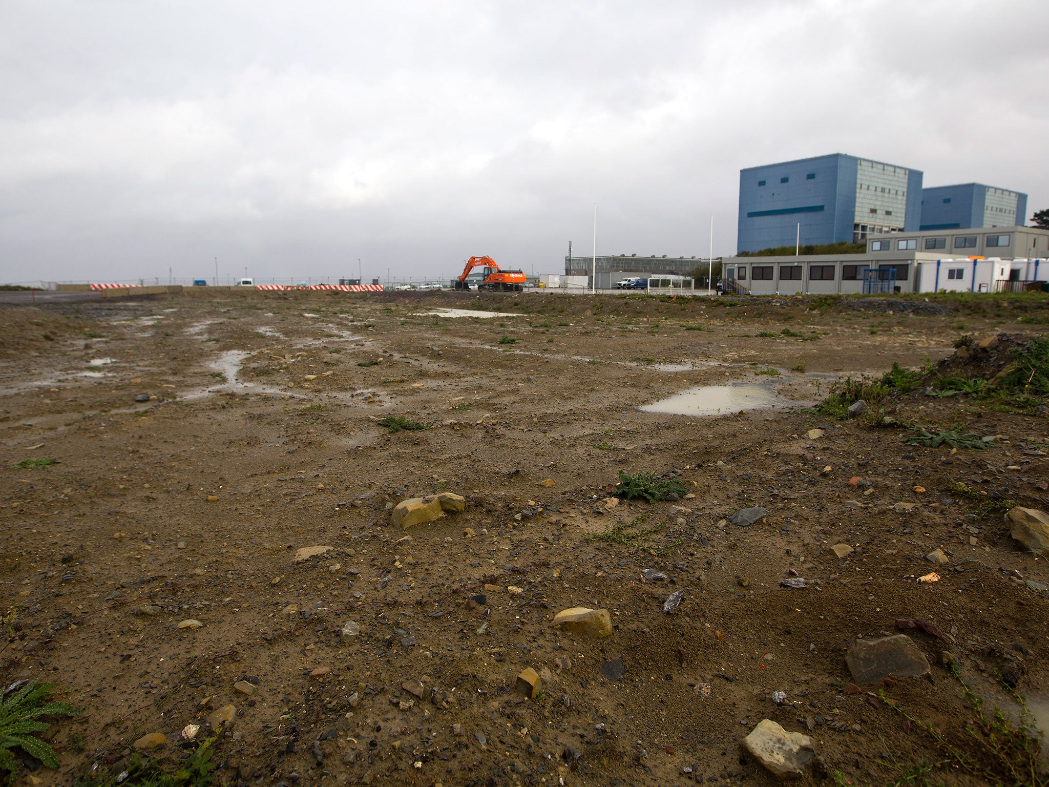 Hinkley Point A to the right of development land where the reactors of Hinkley C nuclear power station are due to be built