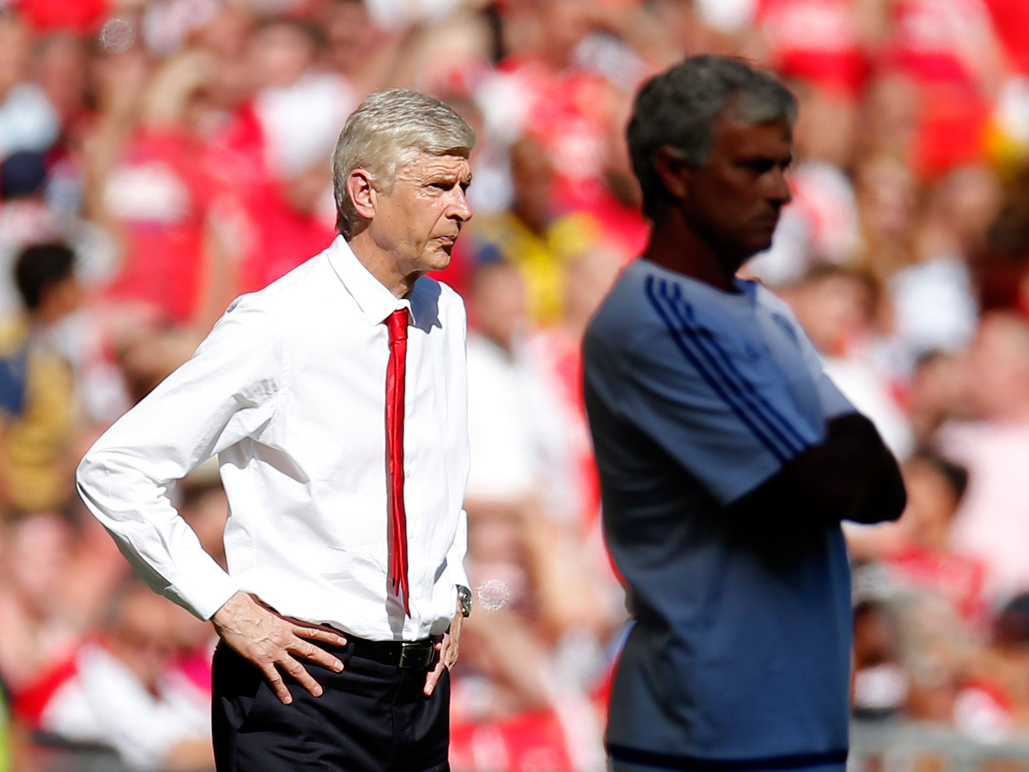 Arsène Wenger and Jose Mourinho display the rivalry that helps fuel the Premier League