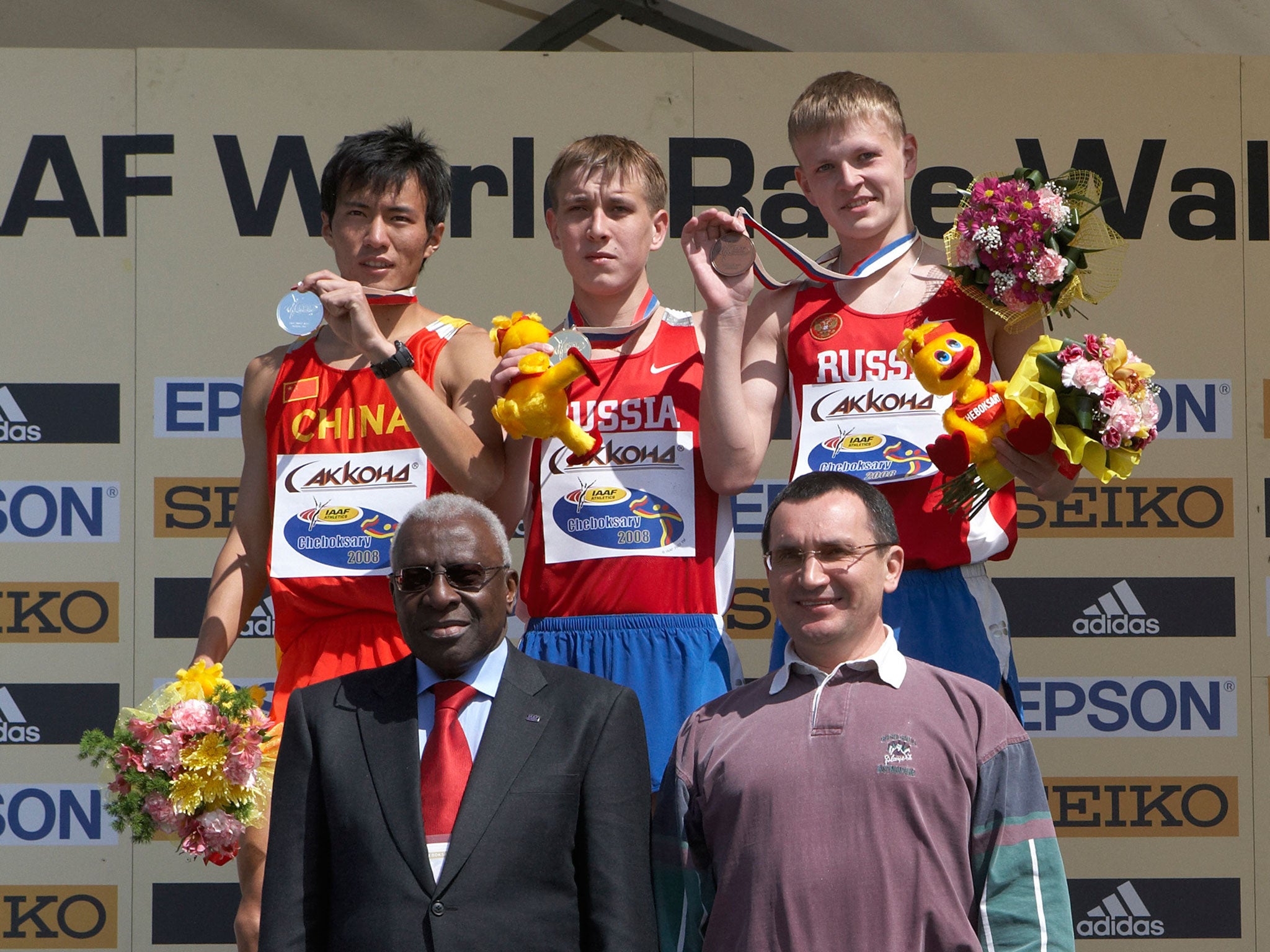 The IAAF president, Lamine Diack, front left, after presenting medals to junior athletes at the World Race Walking Cup in Russia in 2008