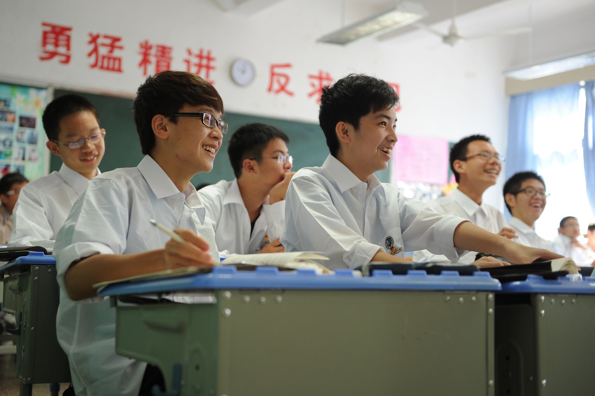 Schoolboys study in Shanghai, where students topped PISA tables in 2012 and 2013