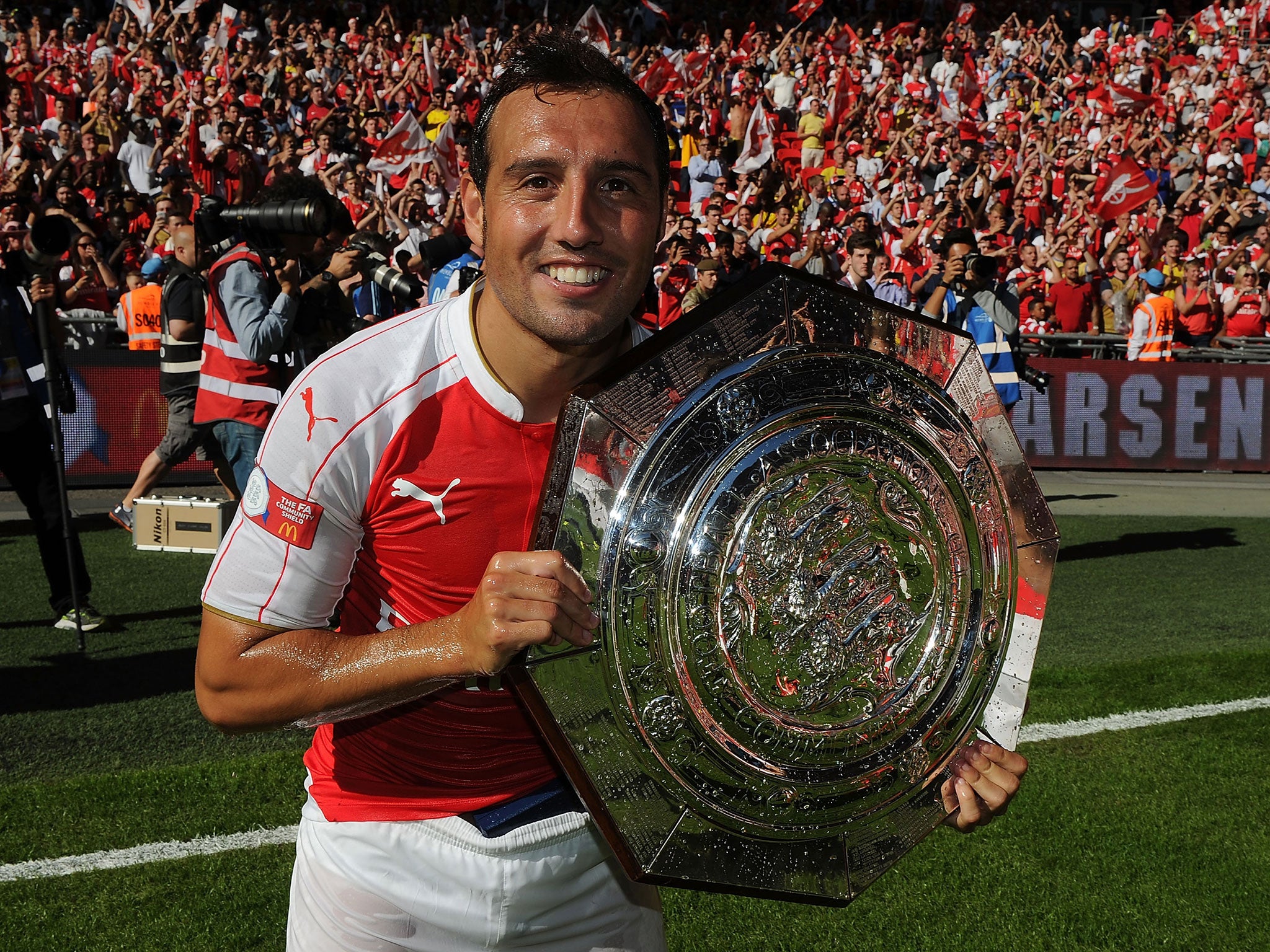 Santi Cazorla poses with the Community Shield