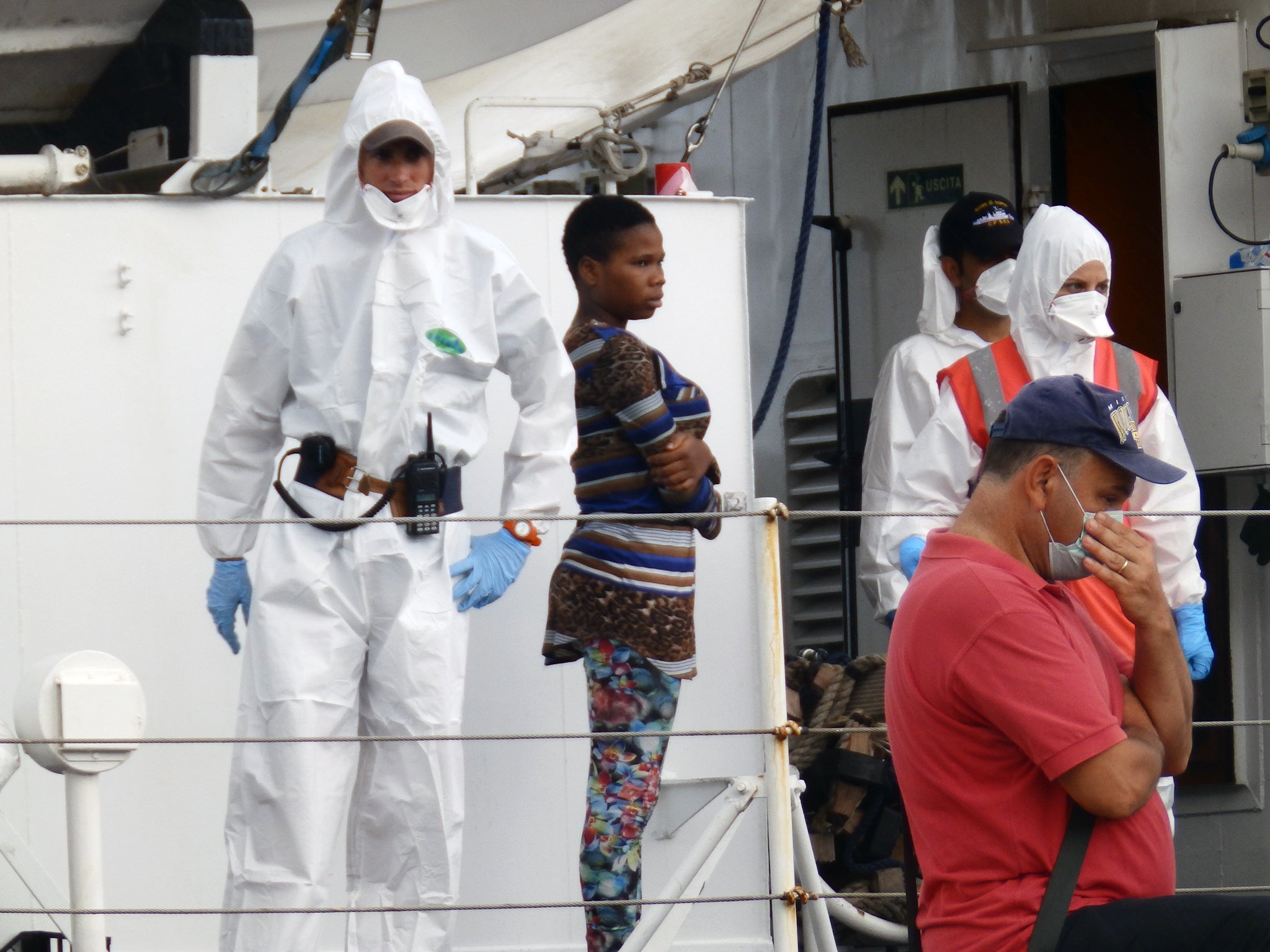 A teenage girl arriving on a rescue boat in Sicily (Lizzie Dearden )