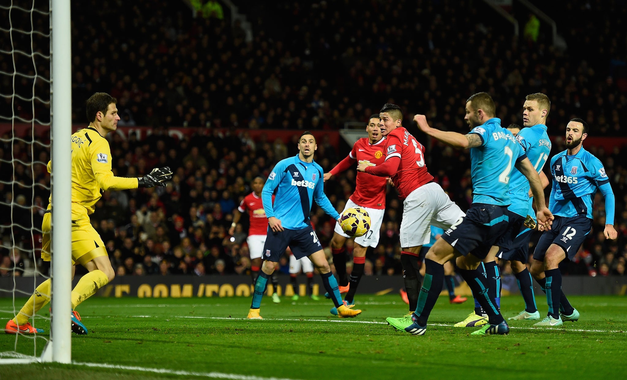 Marcos Rojo, in an offside position, attempts to meet Juan Mata's effort