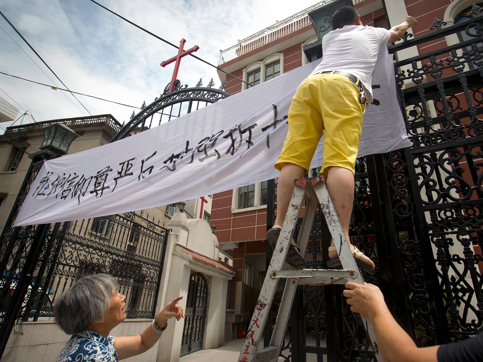 In village churches Christians are defying orders to remove crosses on their own