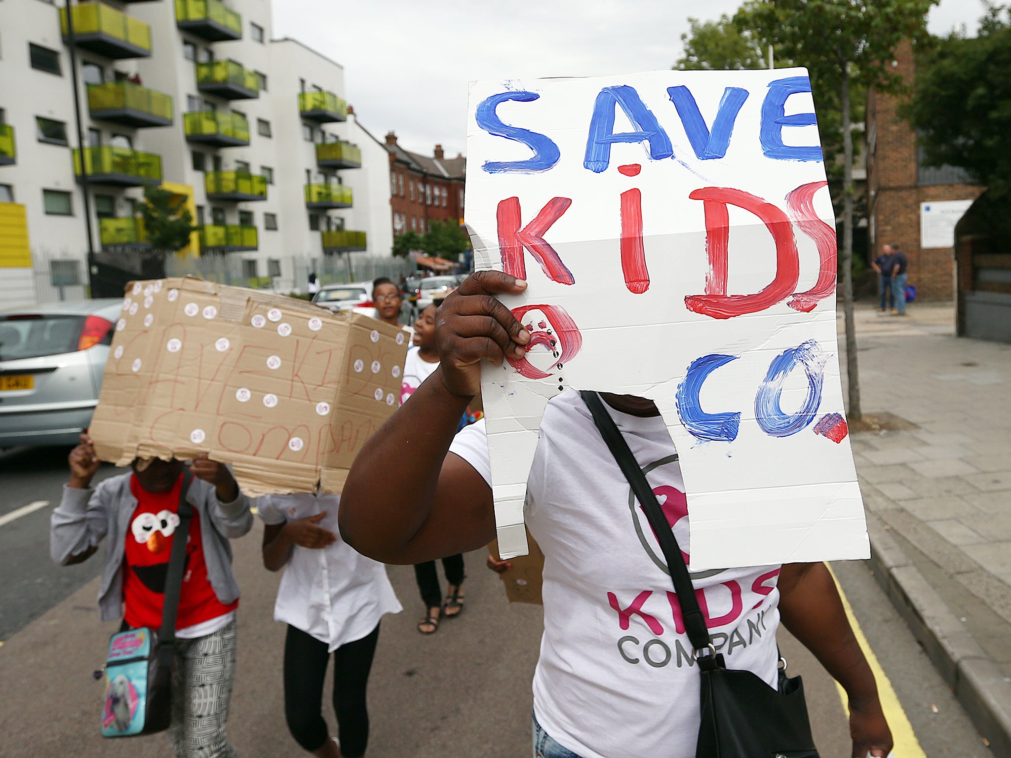 Women take part in a protest near a Kids Company premises in Camberwell.