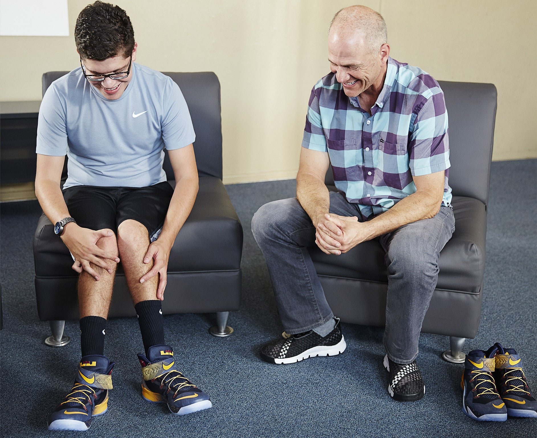 If the shoe fits: teenager Matthew Walzer, with Nike designer Tobie Hatfield, tries on the 8 Flyease