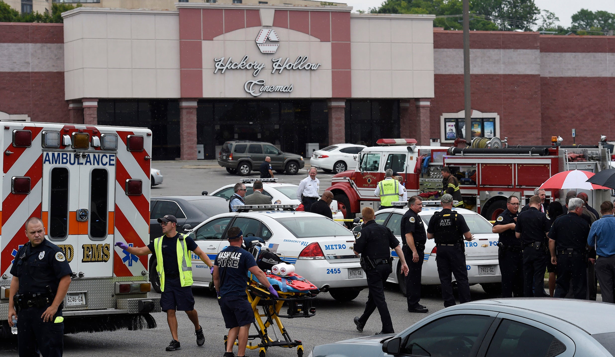 Emergency personnel gather outside Carmike Hickory 8 movie theater following a shooting 5 August 2015.