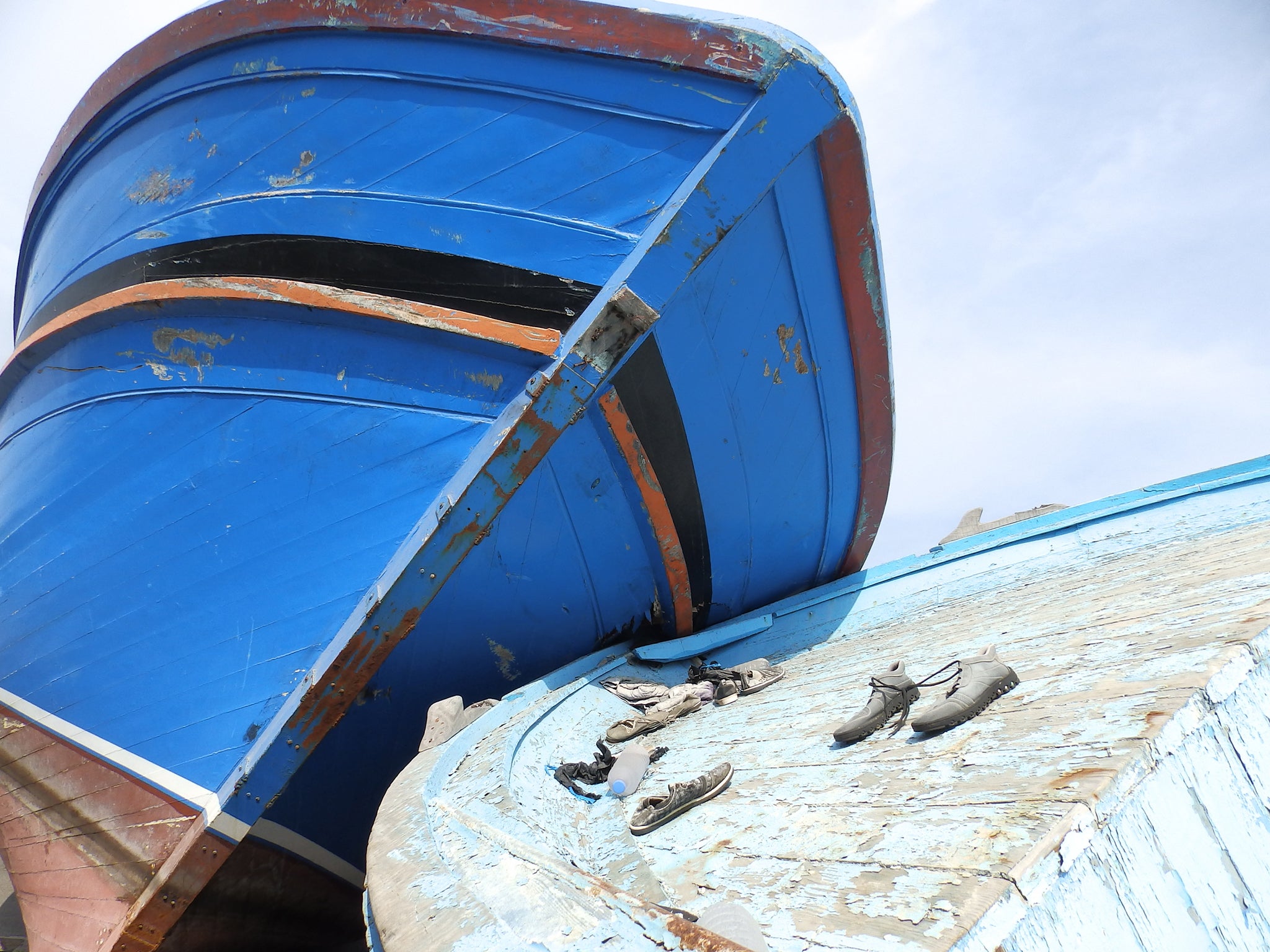 &#13;
Boats formerly used by migrants were left in the port of Pozzallo, Sicily, as a memorial to those who died crossing the Mediterranean &#13;