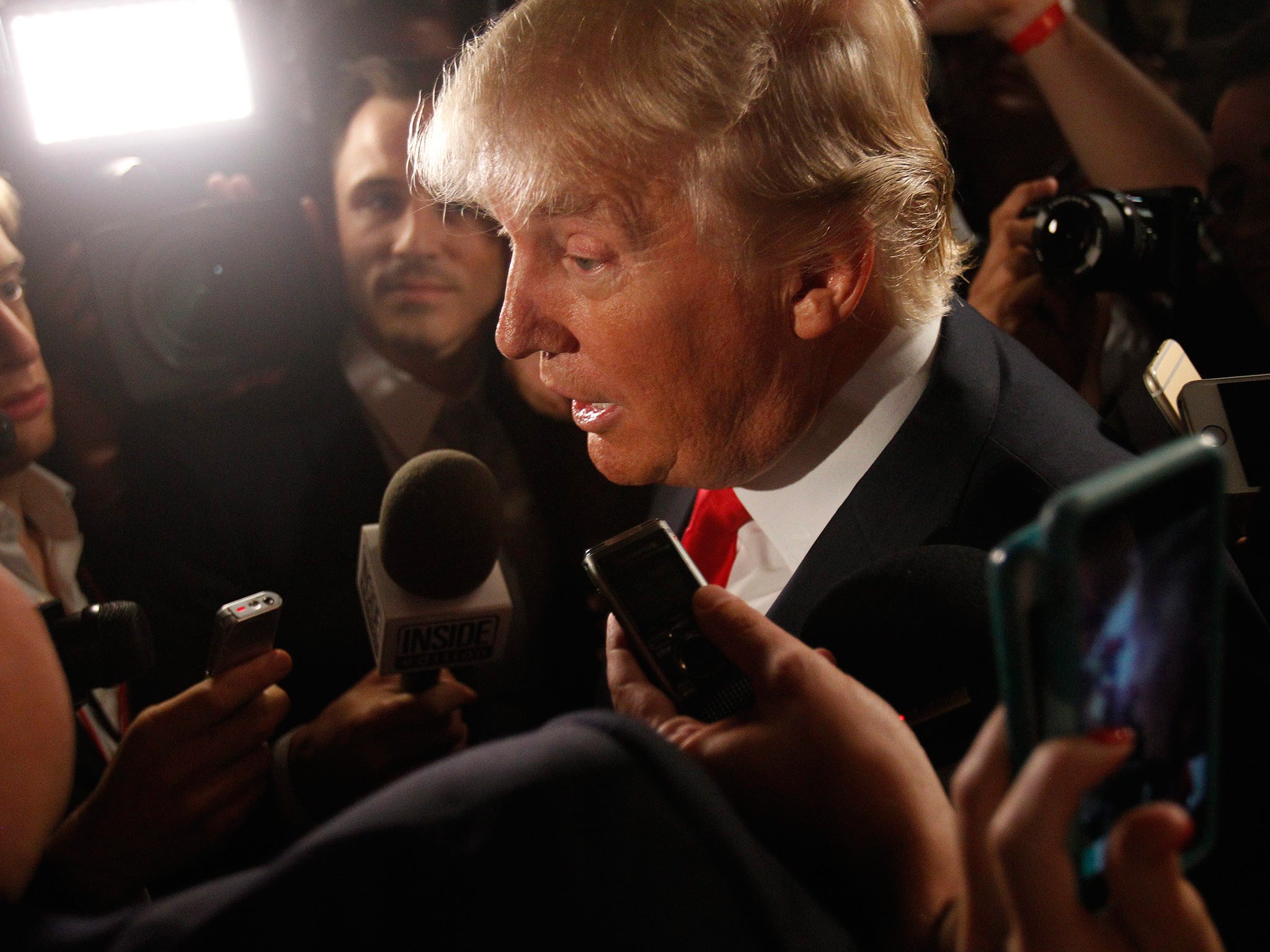 Donald Trump addresses reporters following the debate