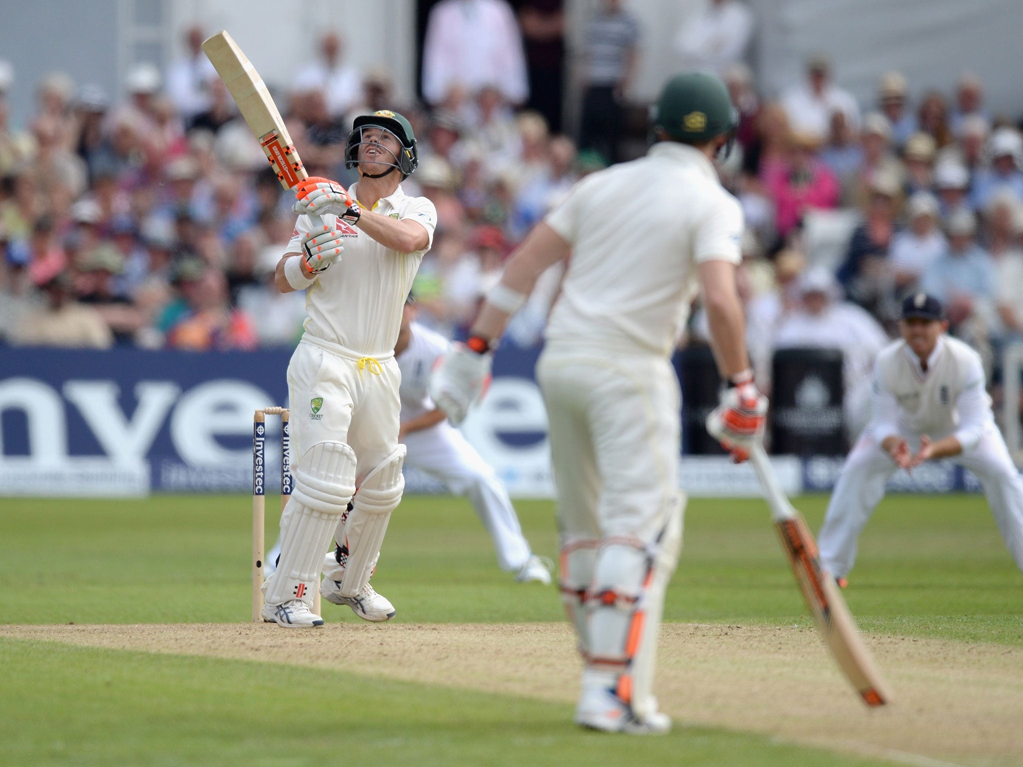 David Warner of Australia hits the ball in the air which is caught out by Stuart Broad