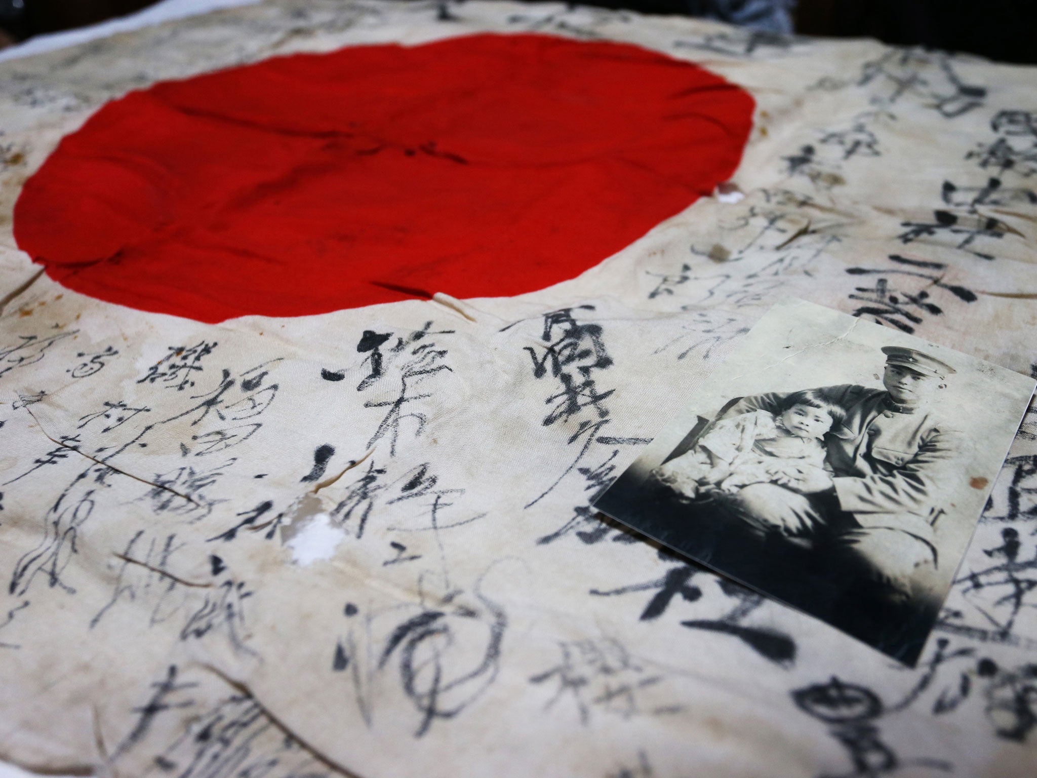 The Japanese flag, covered in hand written script