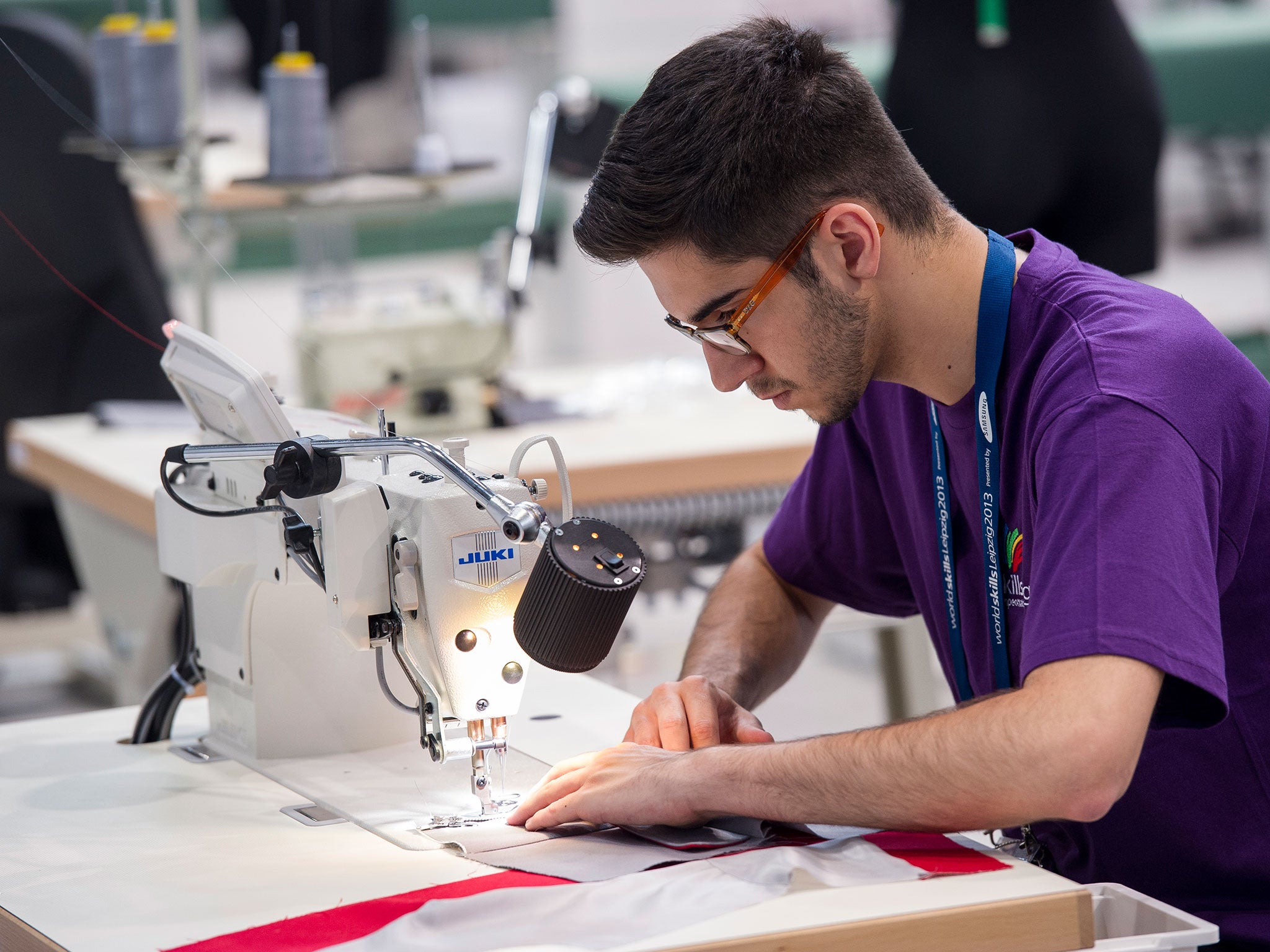 Ruben Damasio from Portugal competes in the category fashion technology at the Worldskills Leipzig 2013 international youth jobs skills competition