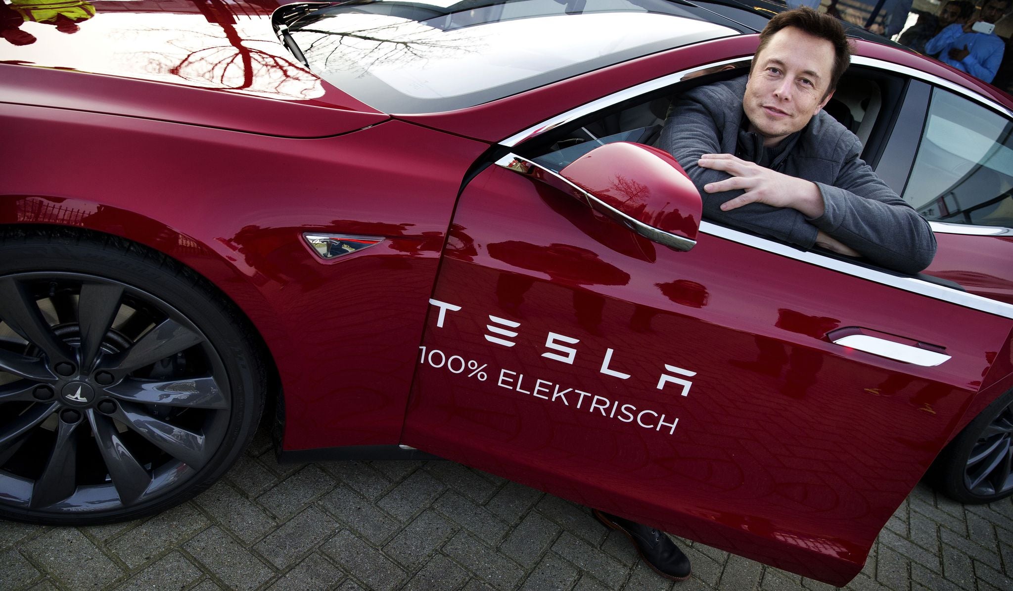 Tesla CEO Elon Musk sits in one of his electric cars on a visit to Amsterdam