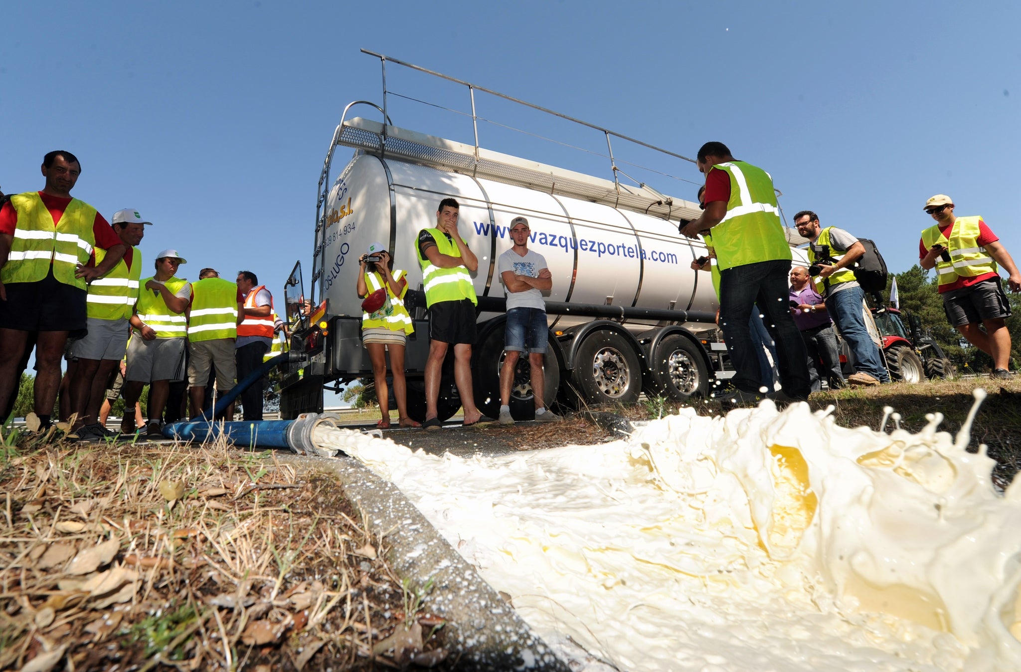 French farmers are facing similar problems to their British counterparts, in one case emptying a tanker of Spanish milk during a protest