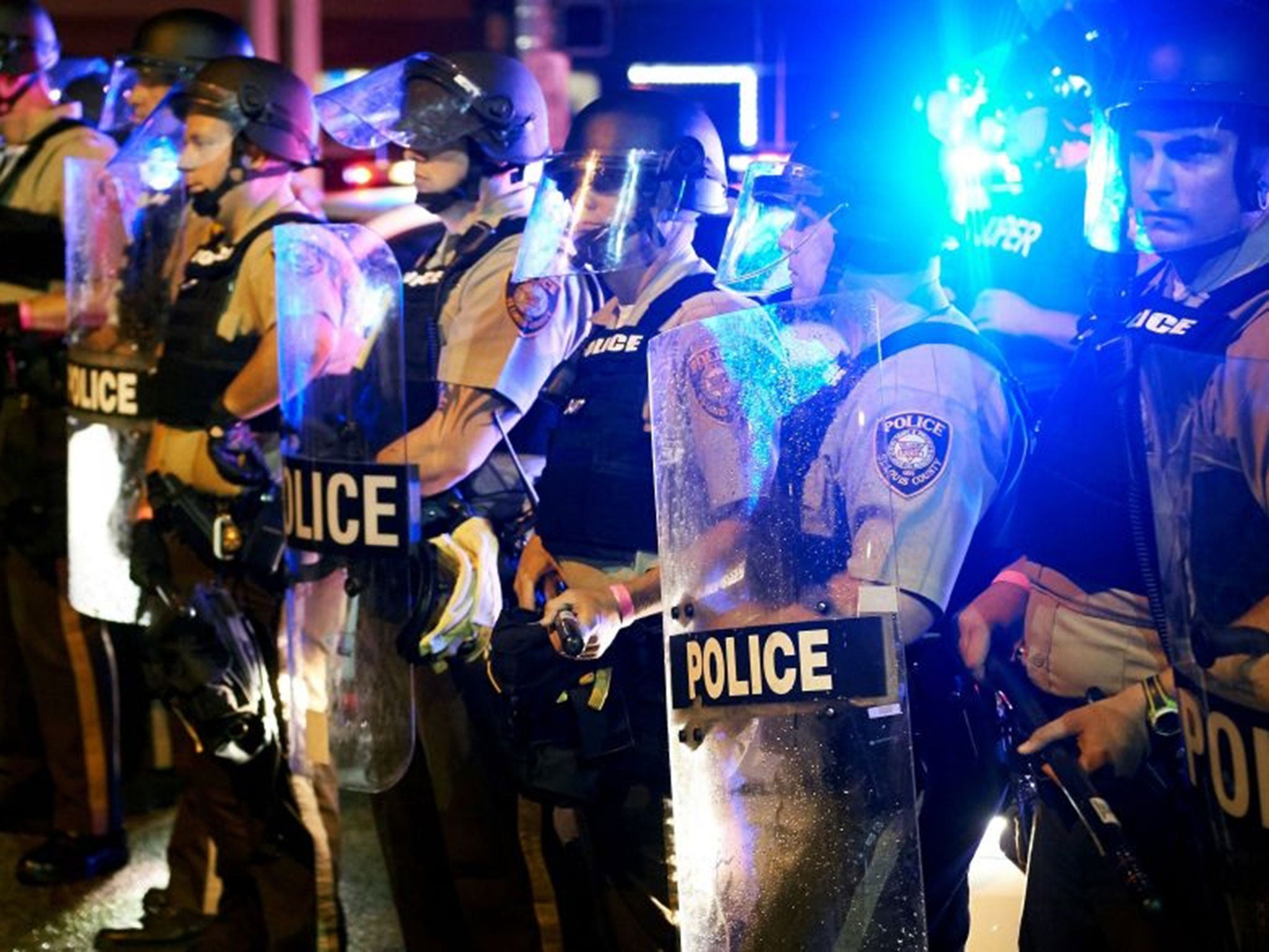 Officers stand guard on West Florissant Avenue (Image: AFP)