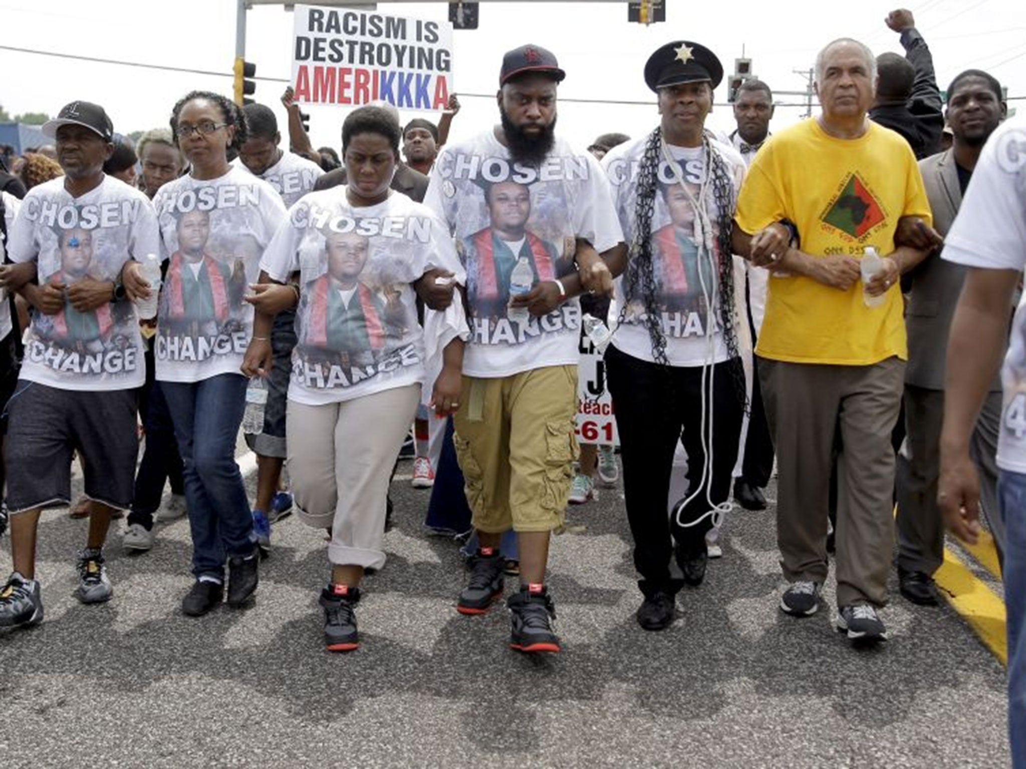 Michael Brown Sr., leads a march in remembrance of his son (Image: Jeff Roberson/AP)