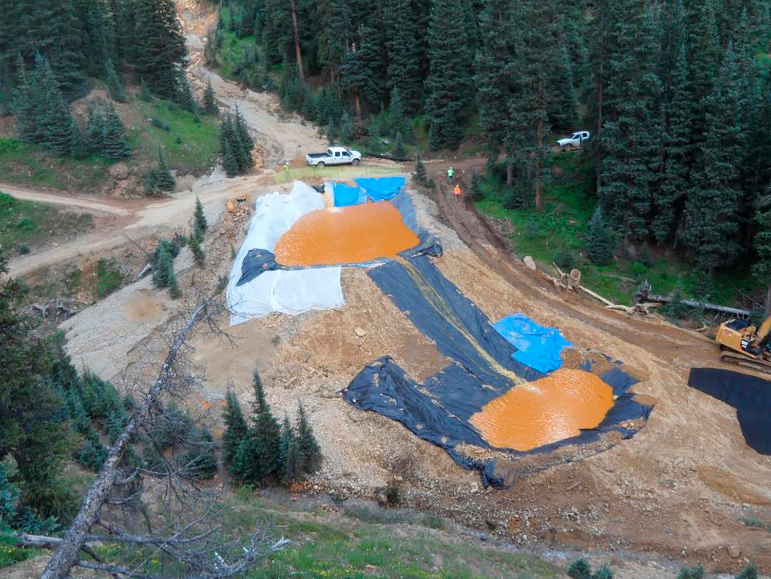 Yellow mine waste water from the Gold King Mine collects in holding pools in San Juan County, Colorado,