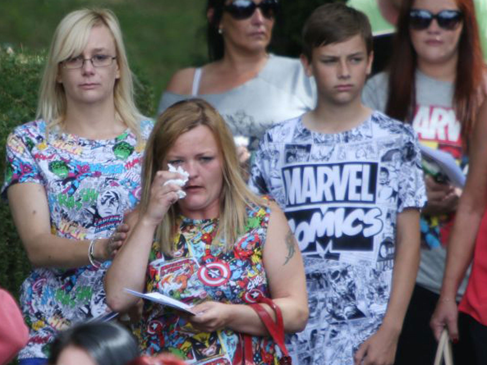 Family and friends wore comic book themed clothes at the little boy's funeral