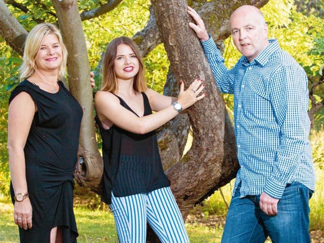 Abi Stone and her parents