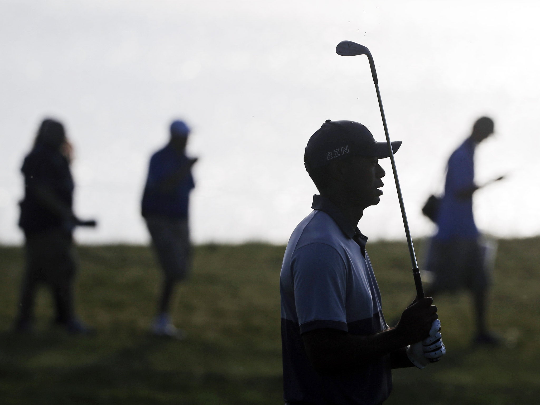 Tiger Woods watches his shot on the second hole during a practice round at Whistling Straits