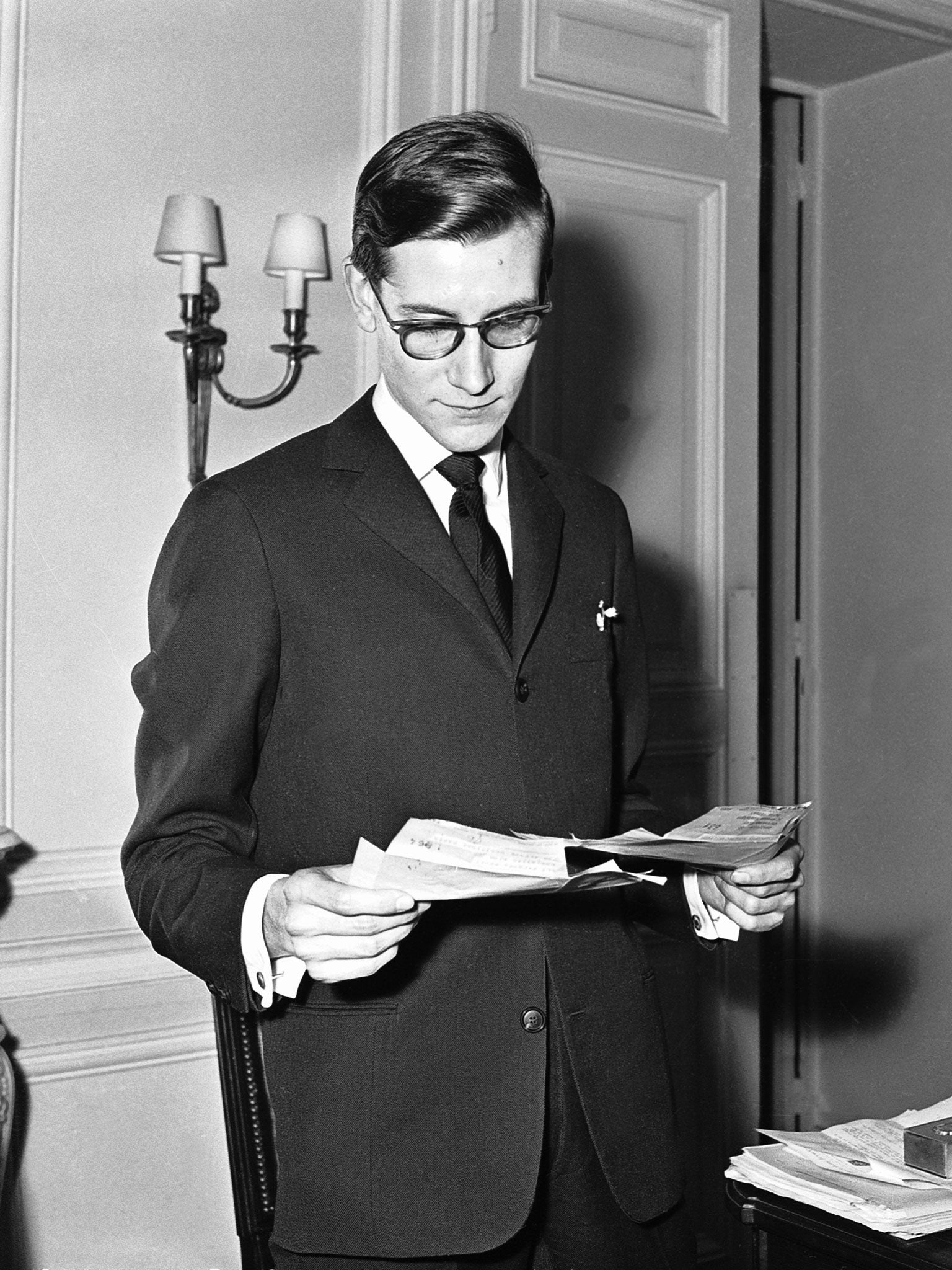 Yves Saint Laurent at his Christian Dior office in 1958 (Getty)