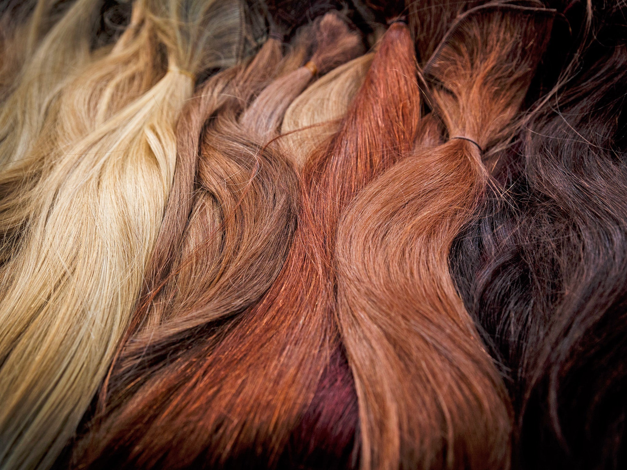 Hair extensions backstage at a fashion show (Getty)