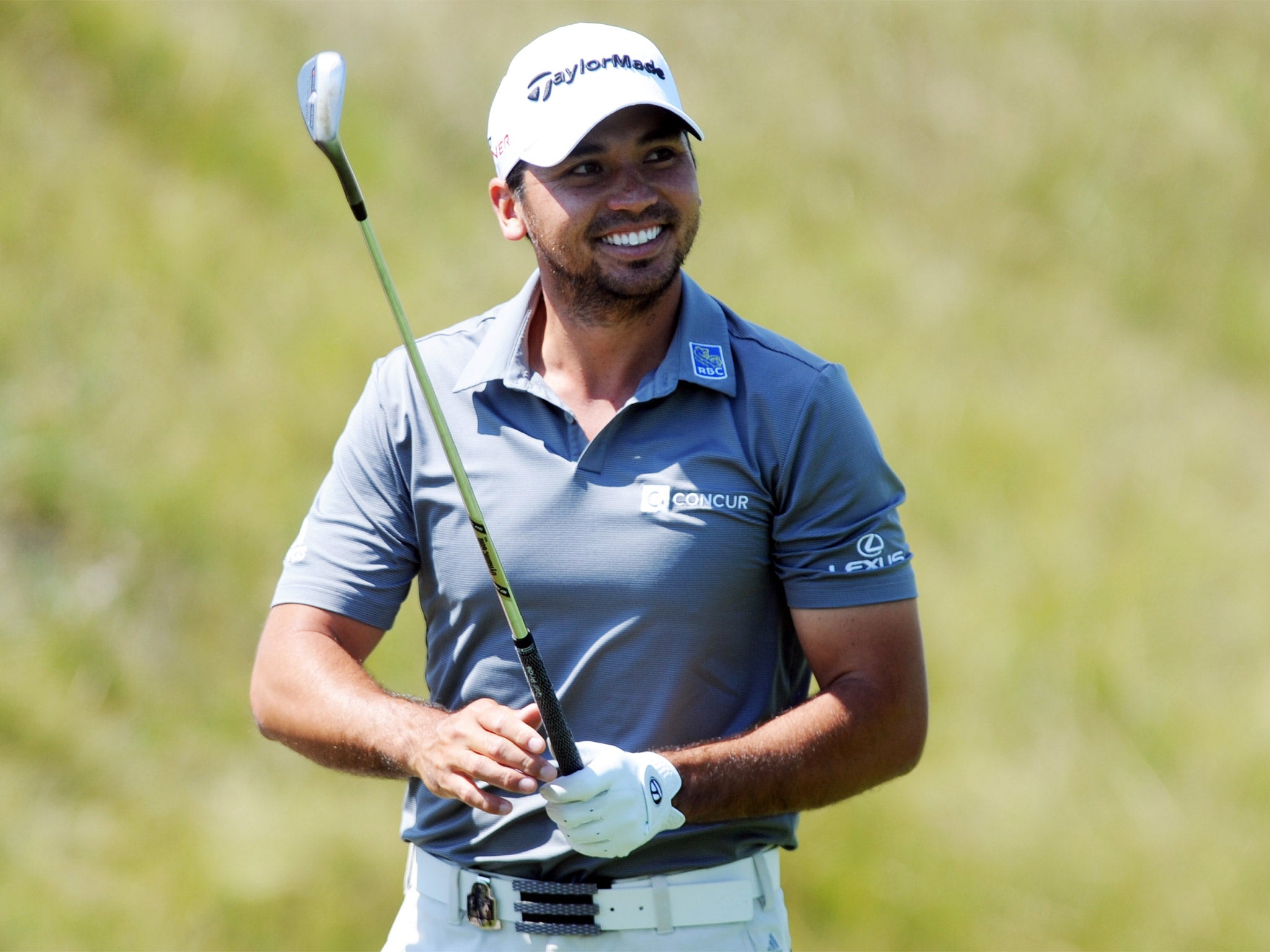 Jason Day smiles on the driving range during a practice round on Wednesday