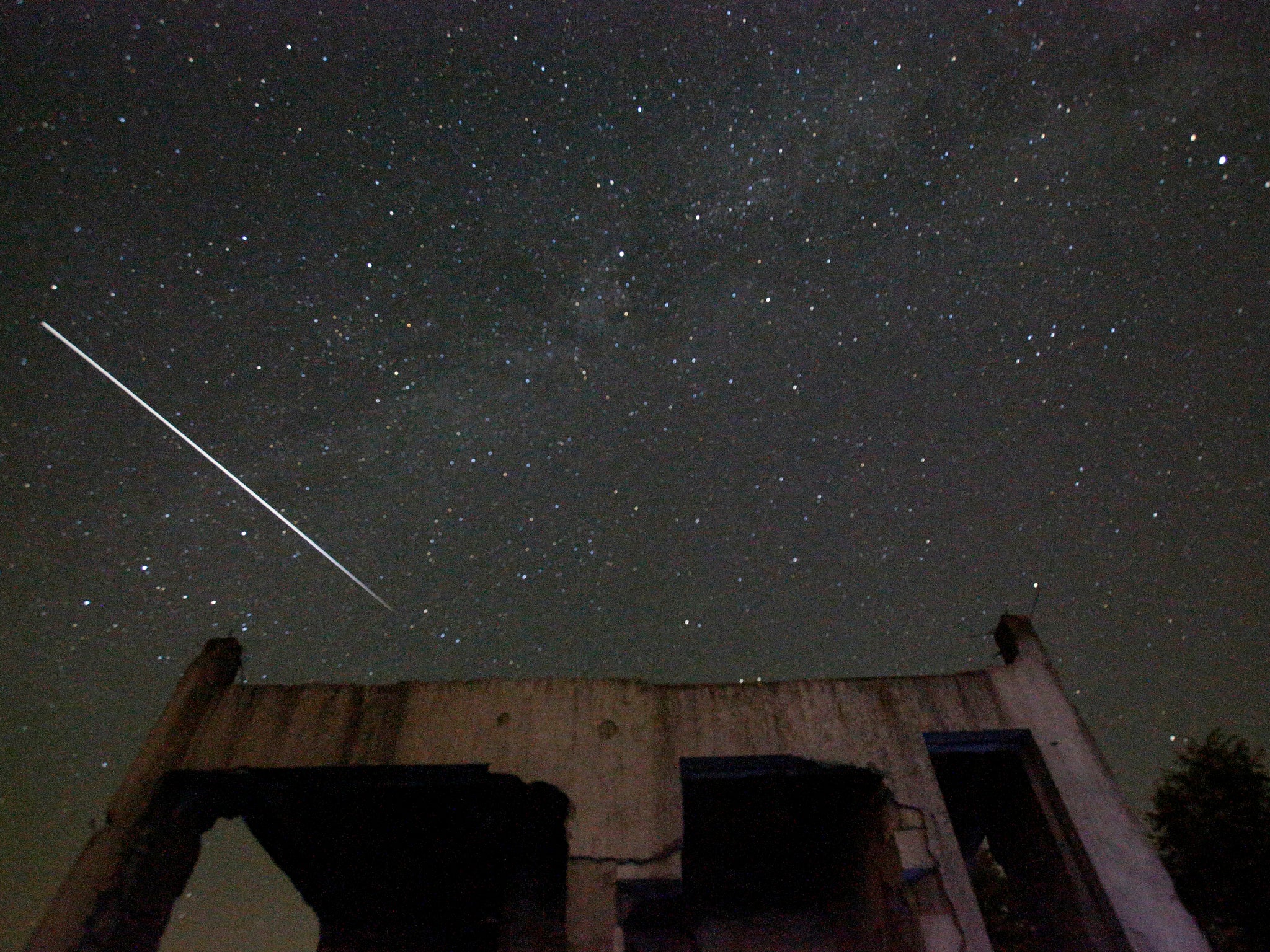 meteor visible above destroyed house near Tuzla, Bosnia,