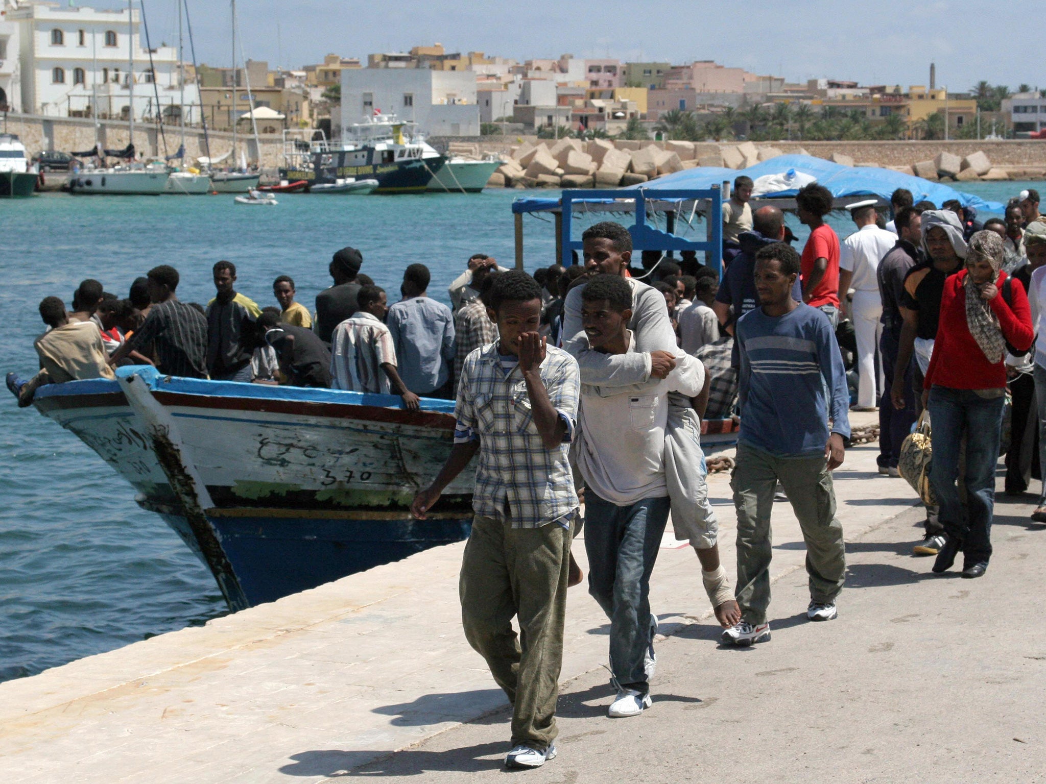 Asylum seekers from Eritreat arrive in southern Italy (AFP/Getty)