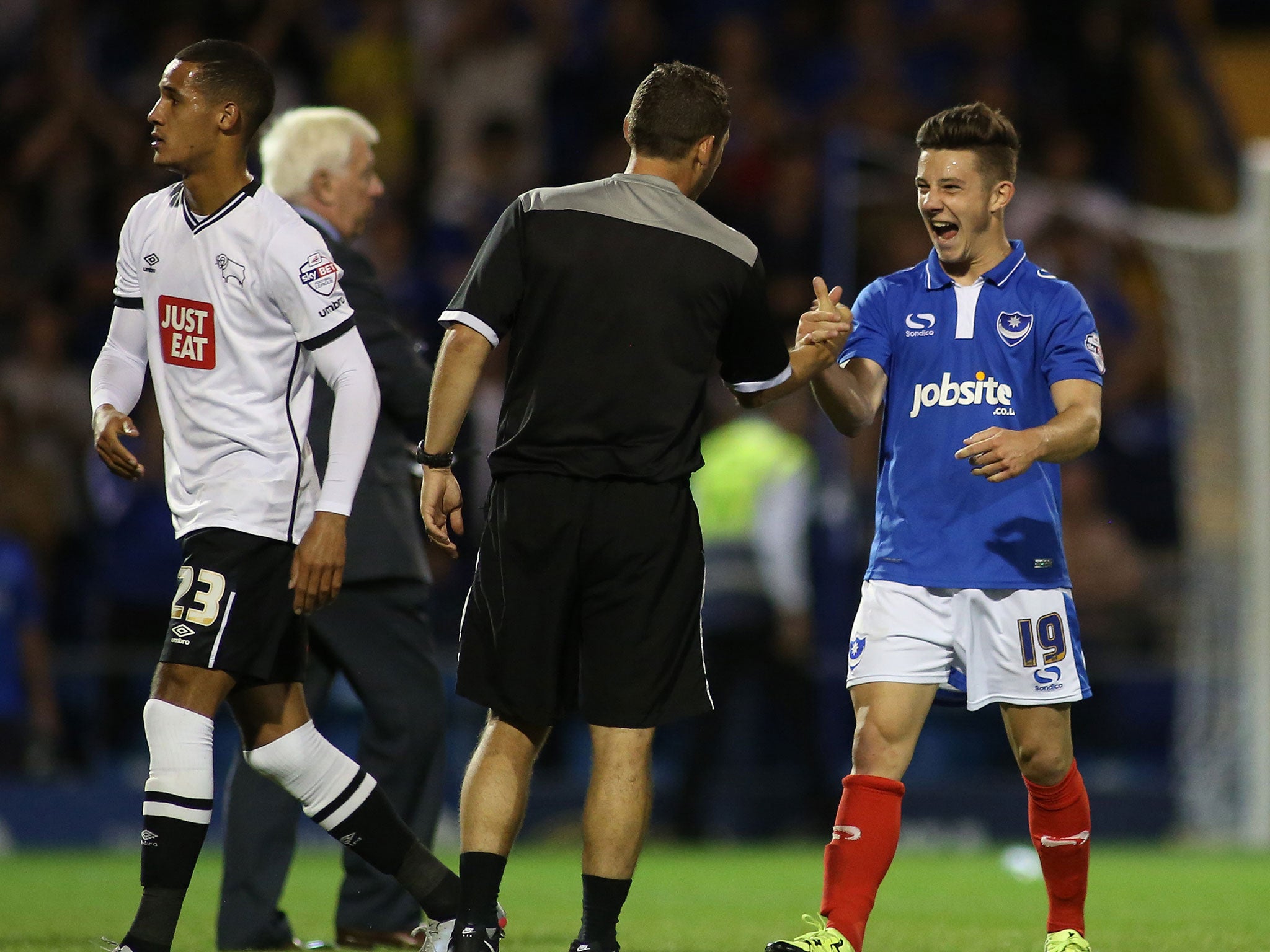 Portsmouth’s 18-year-old striker Conor Chaplin (right) is congratulated at the final whistle after scoring their winner against Derby on Wednesda