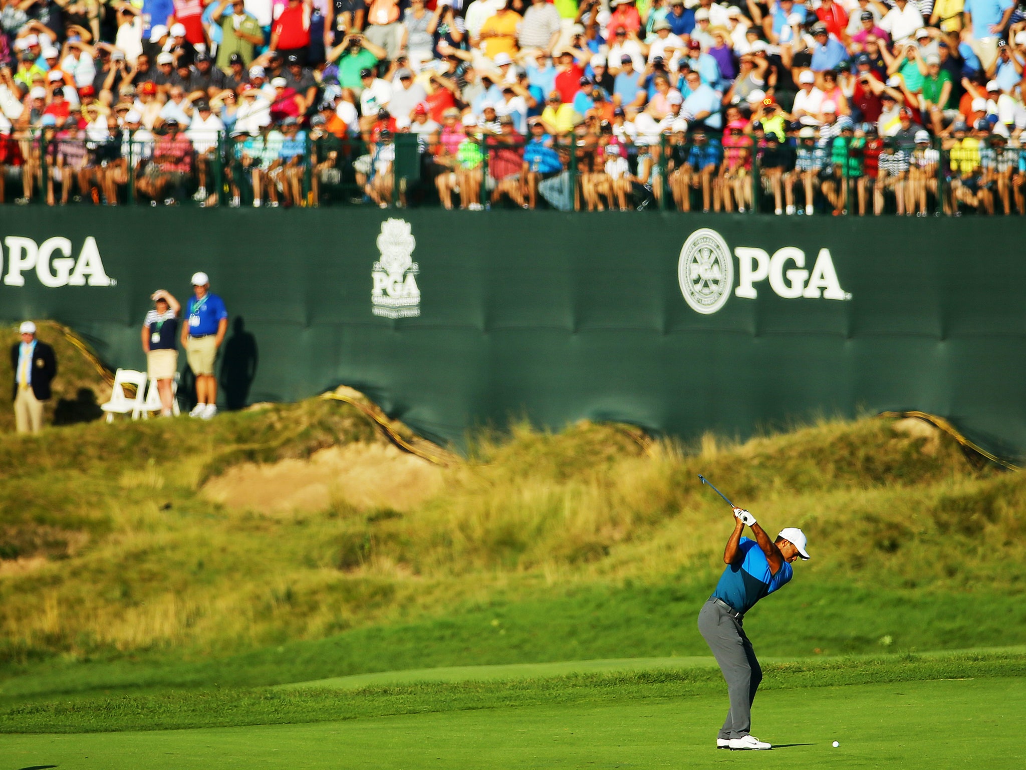 Tiger Woods returned to Whistling Straits at 7am to complete the final five holes of his disrupted second round