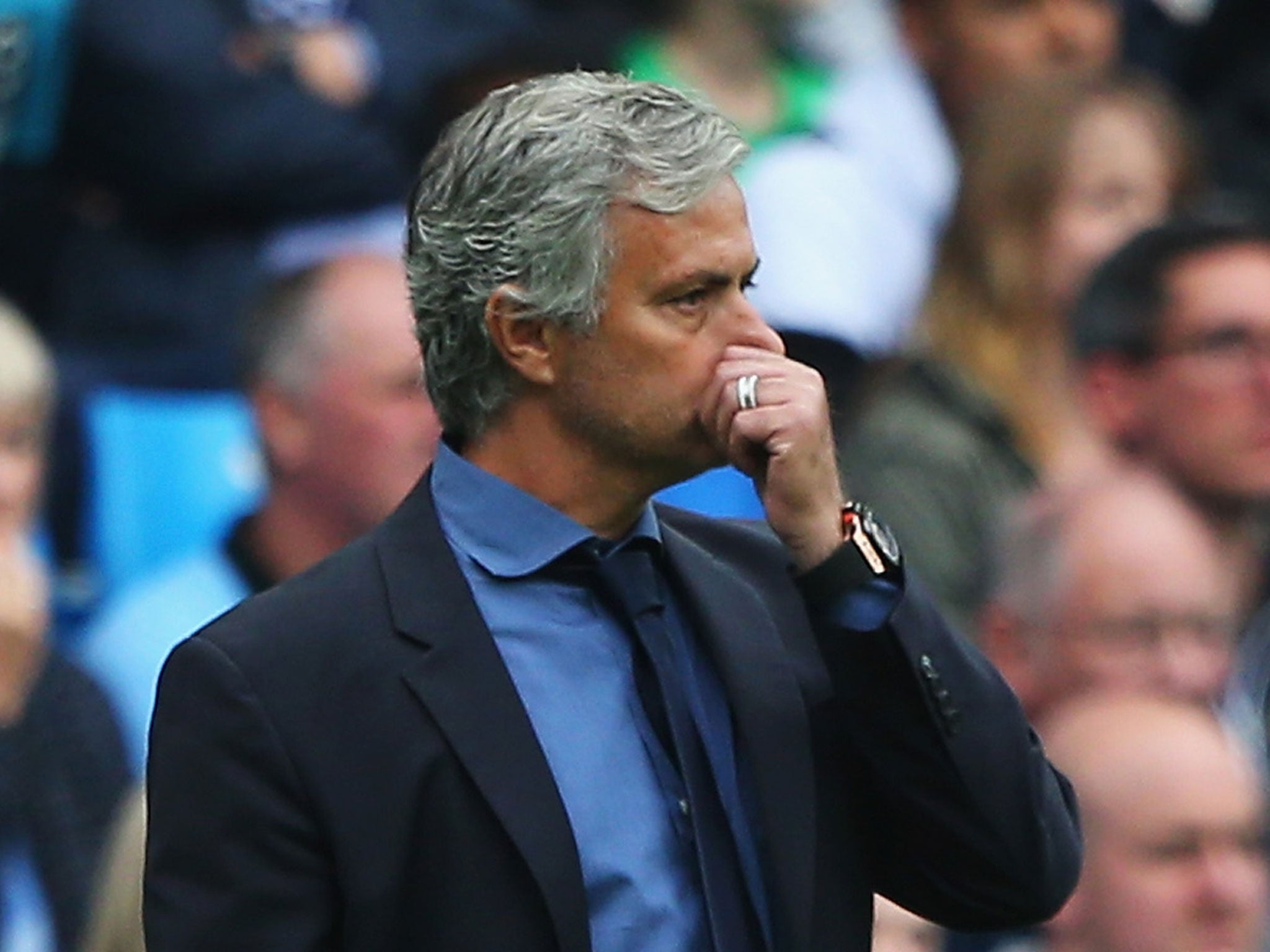 A frustrated Jose Mourinho looks on from the stands