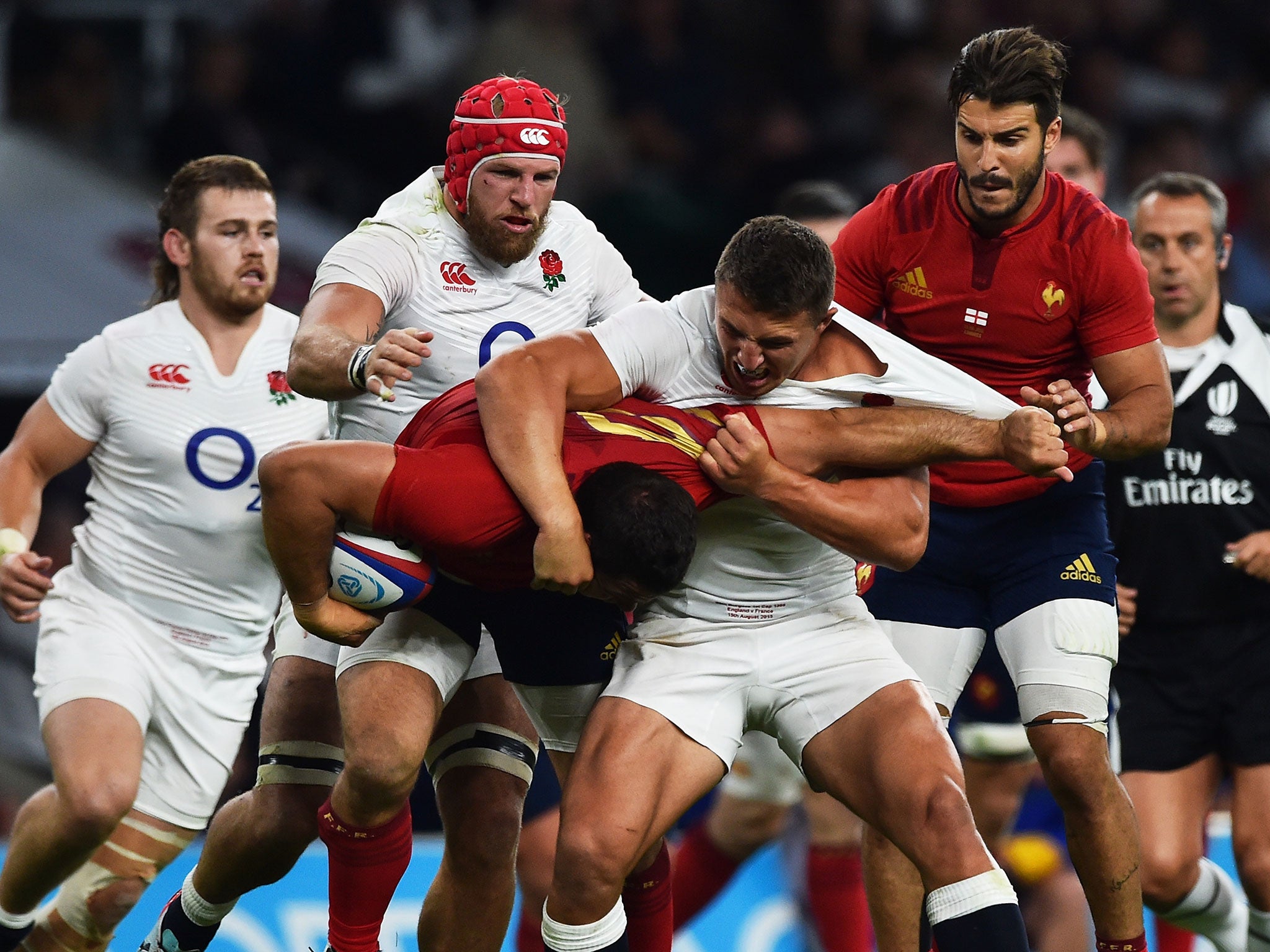 Sam Burgess wrestles France’s Guilhem Guirado to the ground