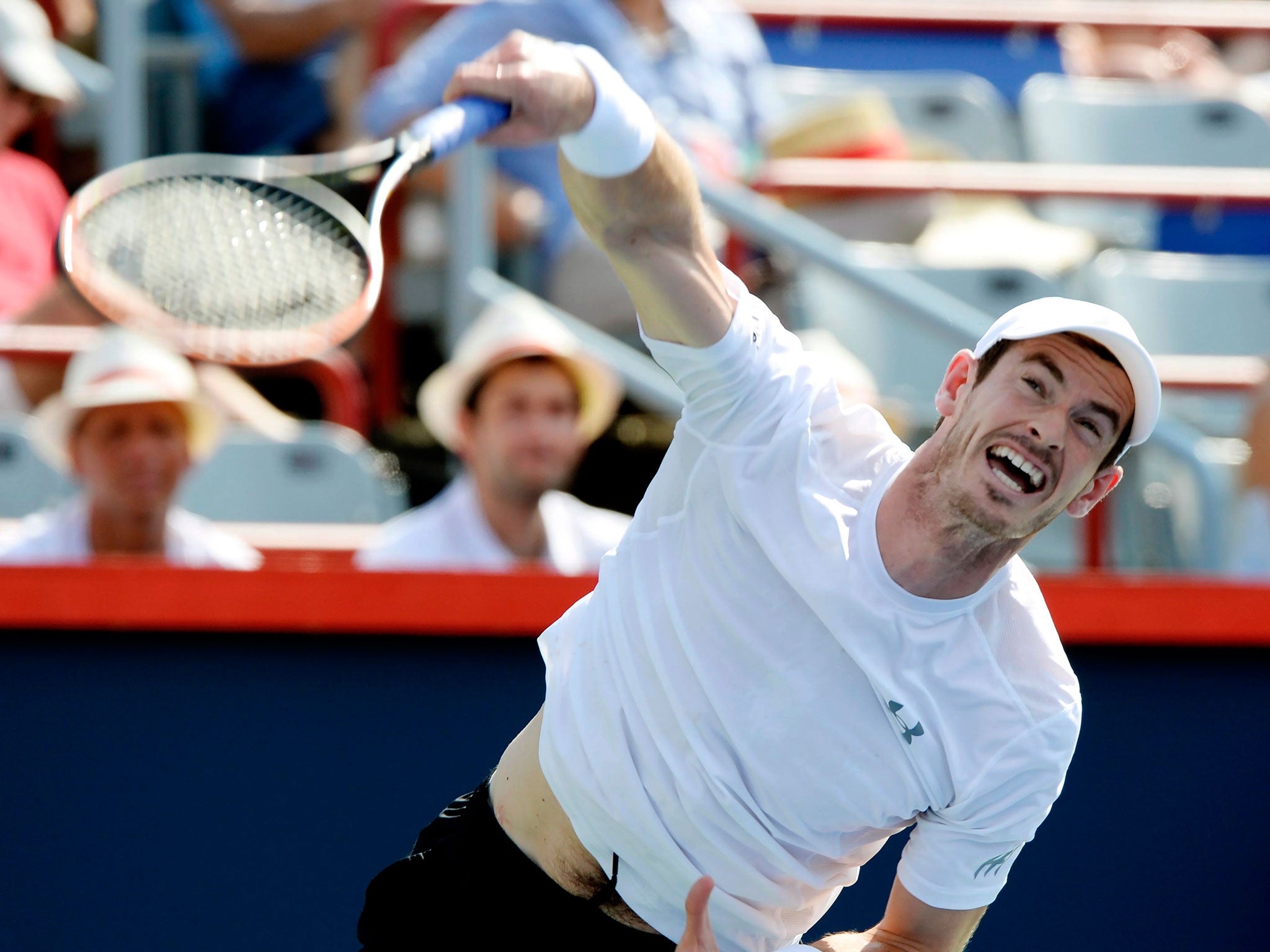 Andy Murray serves to Novak Djokovic during the men's final at the Rogers Cup tennis tournament in Montreal