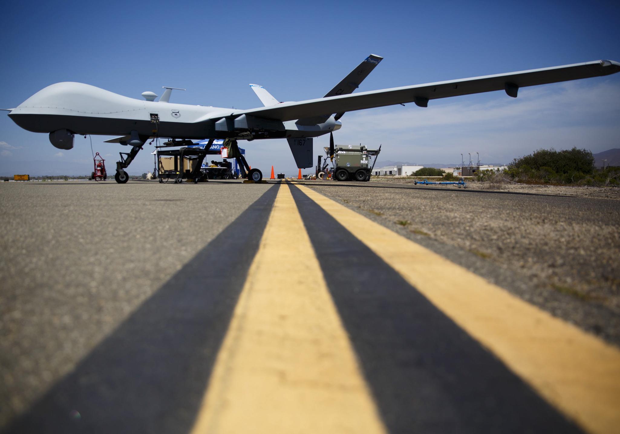 A General Atomics MQ-9 Reaper stands on the runway during a drone demonstration of at a California Naval base in 2015.