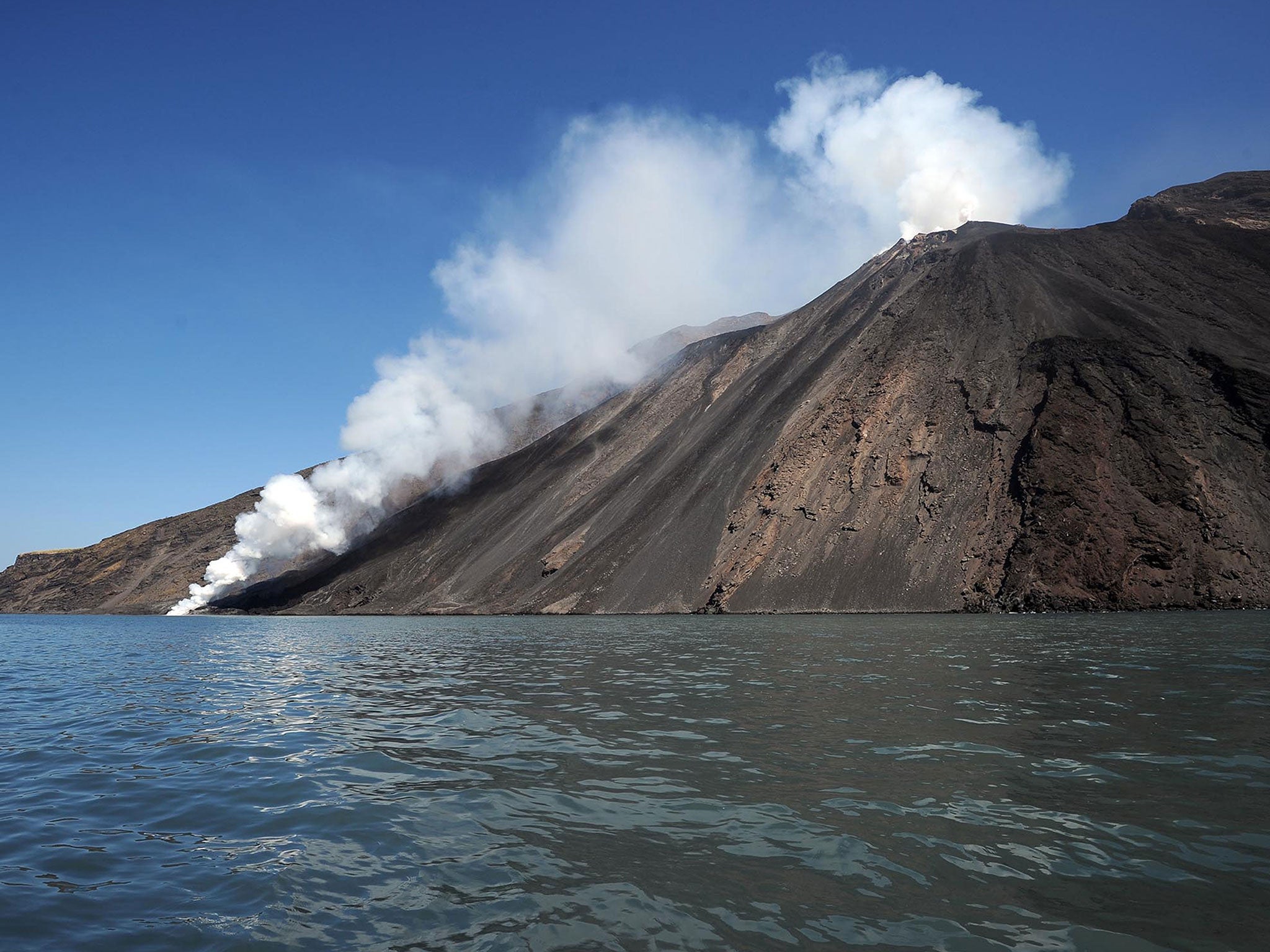 Lava from the Stromboli volcano flows into the sea. Stromboli, one of Europe's most active volcano, is part of the seven-island Eolian Archipelago just off Sicily in southern Italy