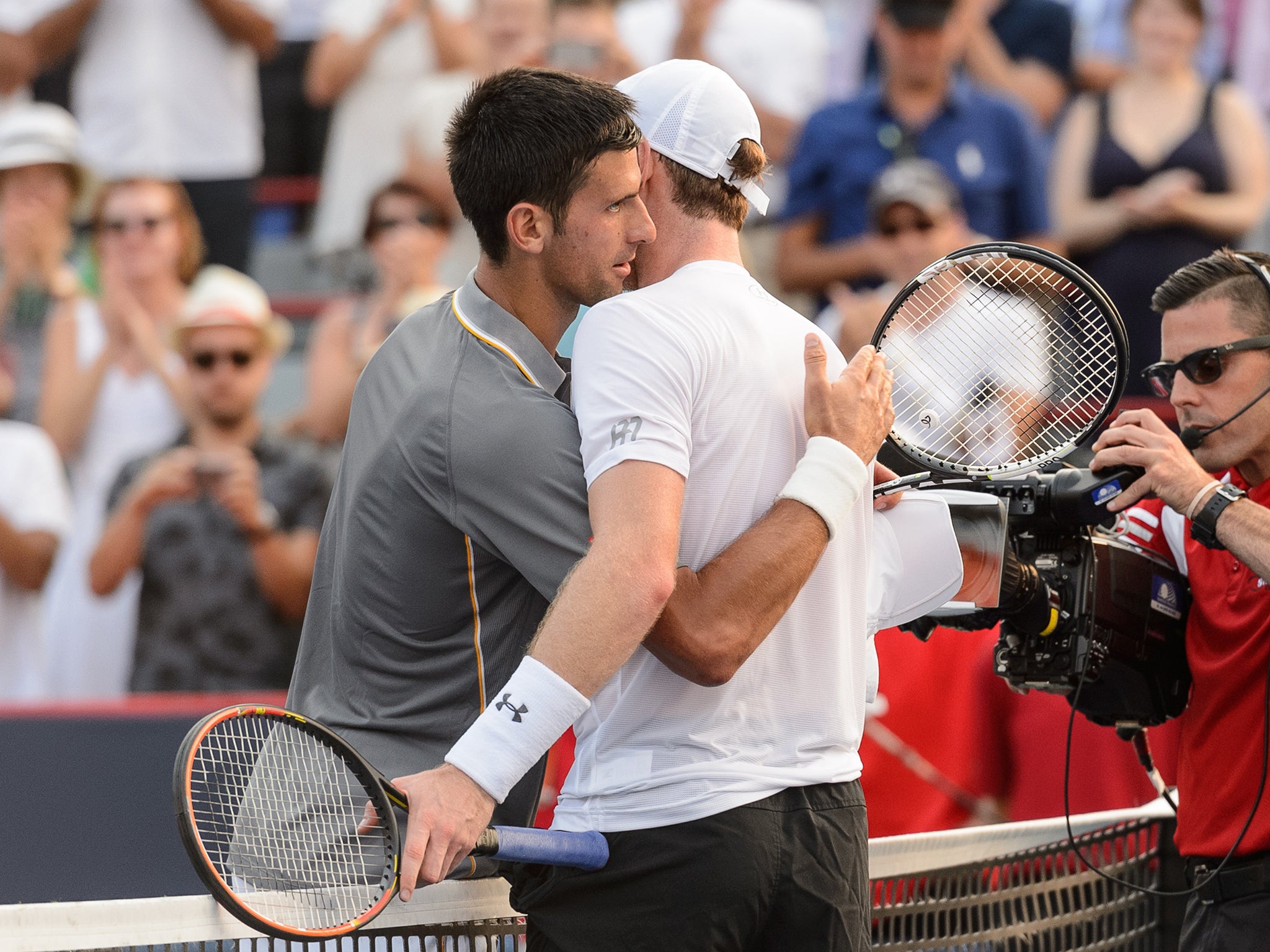 Murray and Djokovic embrace at the end of the final